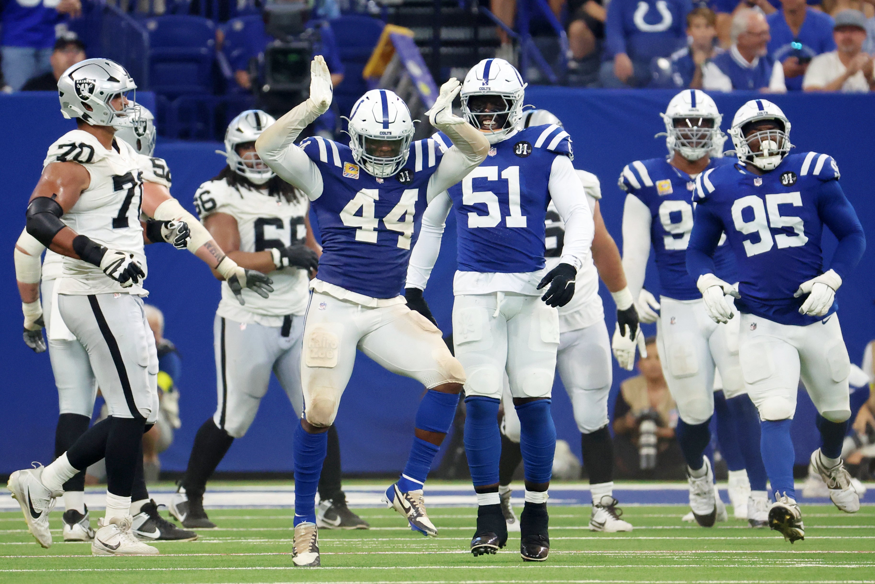 Colts defense celebrates a sack