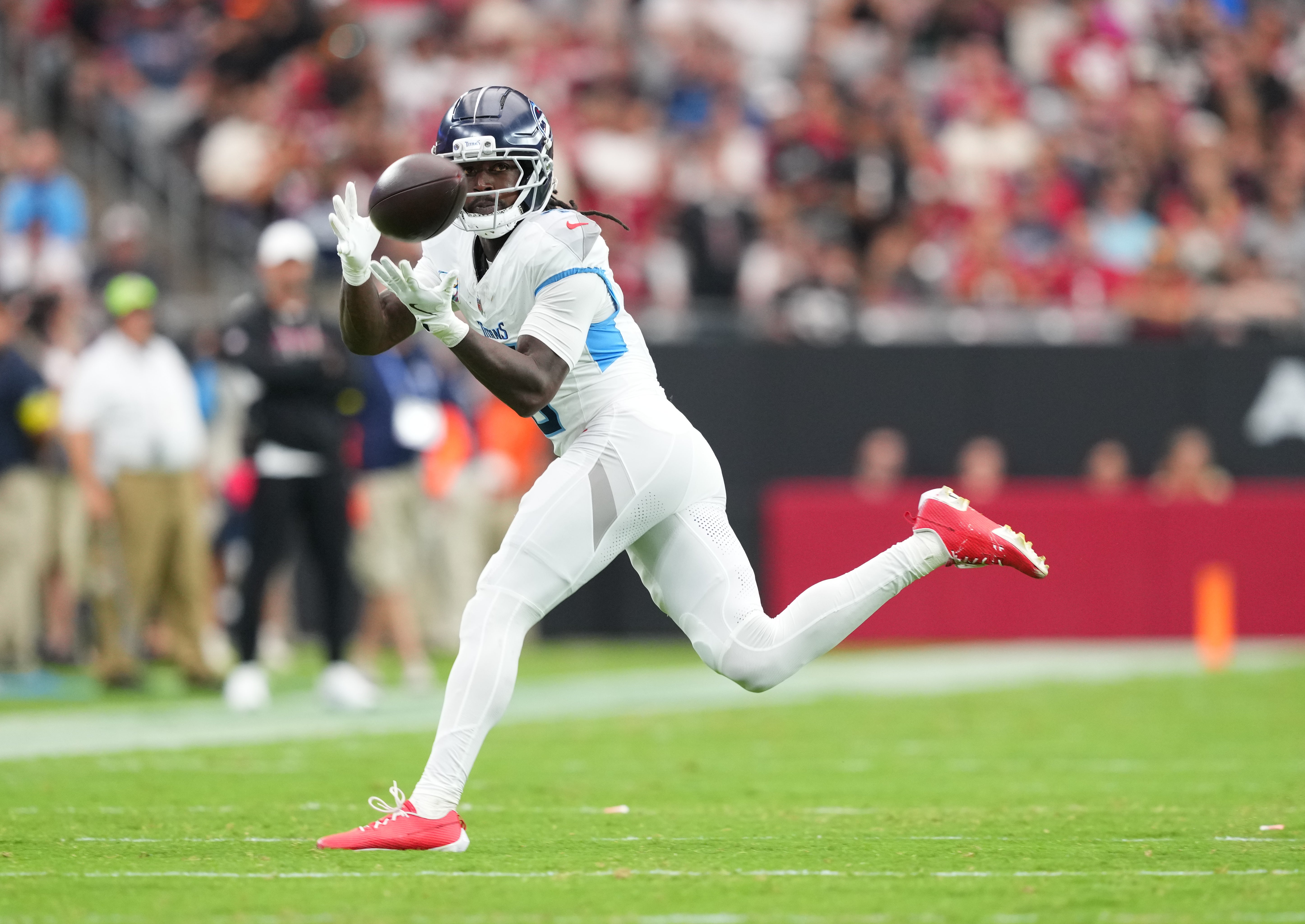 Oct 5, 2025; Glendale, Arizona, USA; Tennessee Titans wide receiver Calvin Ridley (0) makes a catch against the Arizona Cardinals during the second quarter at State Farm Stadium.