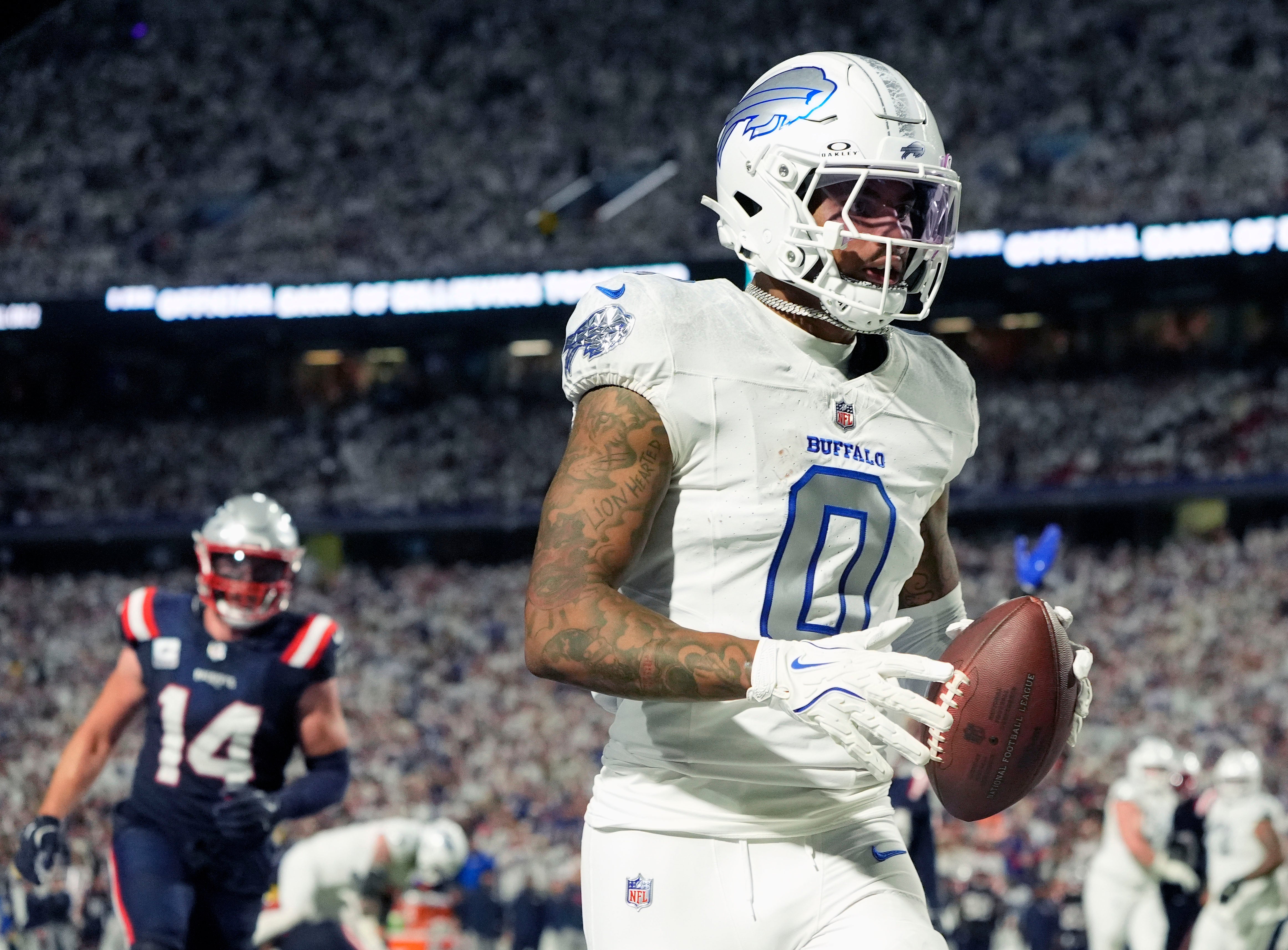 Oct 5, 2025; Orchard Park, New York, USA; Buffalo Bills wide receiver Keon Coleman (0) makes a touchdown catch against the New England Patriots during the second half at Highmark Stadium.