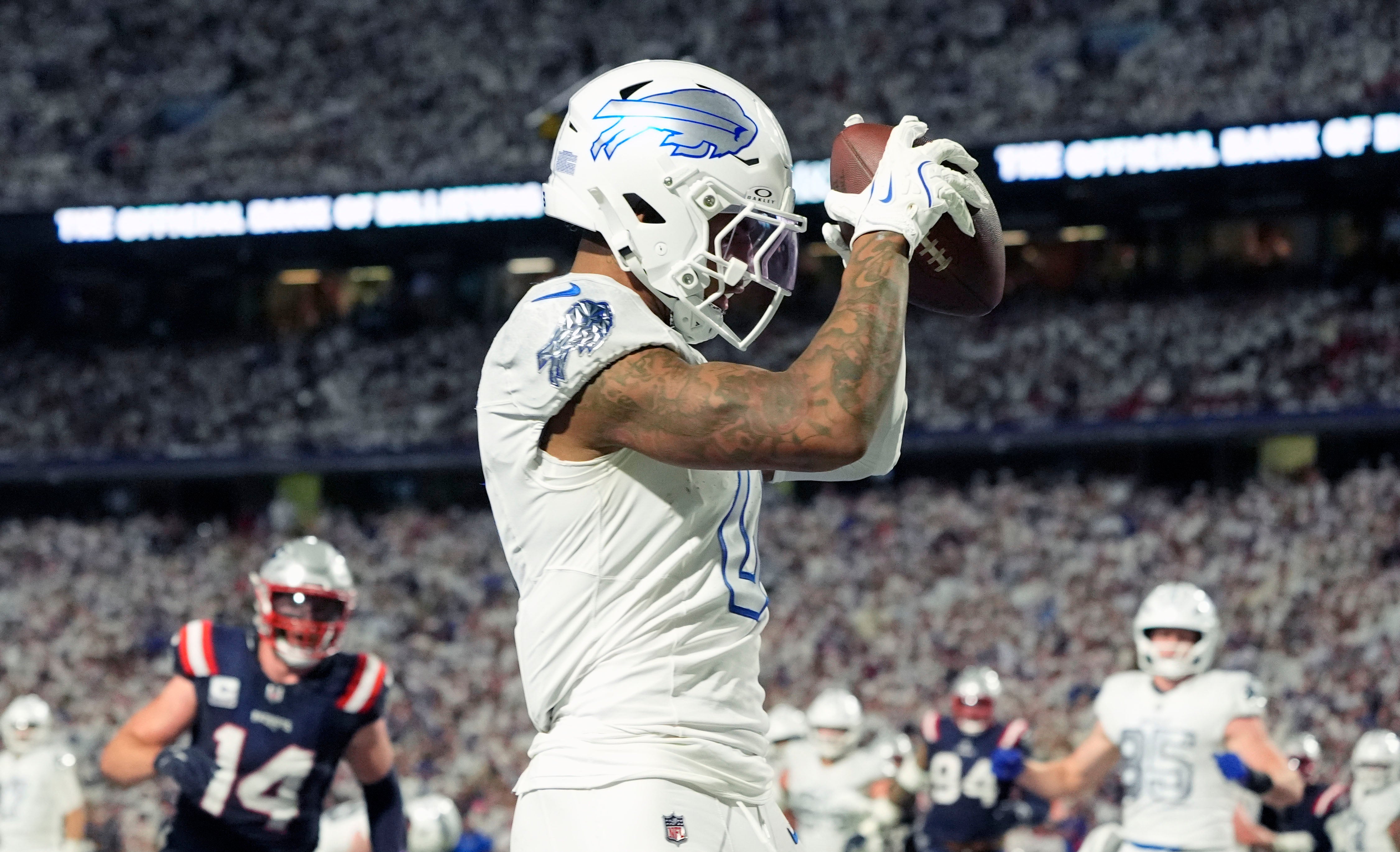 Oct 5, 2025; Orchard Park, New York, USA; Buffalo Bills wide receiver Keon Coleman (0) makes a touchdown catch against the New England Patriots during the second half at Highmark Stadium.