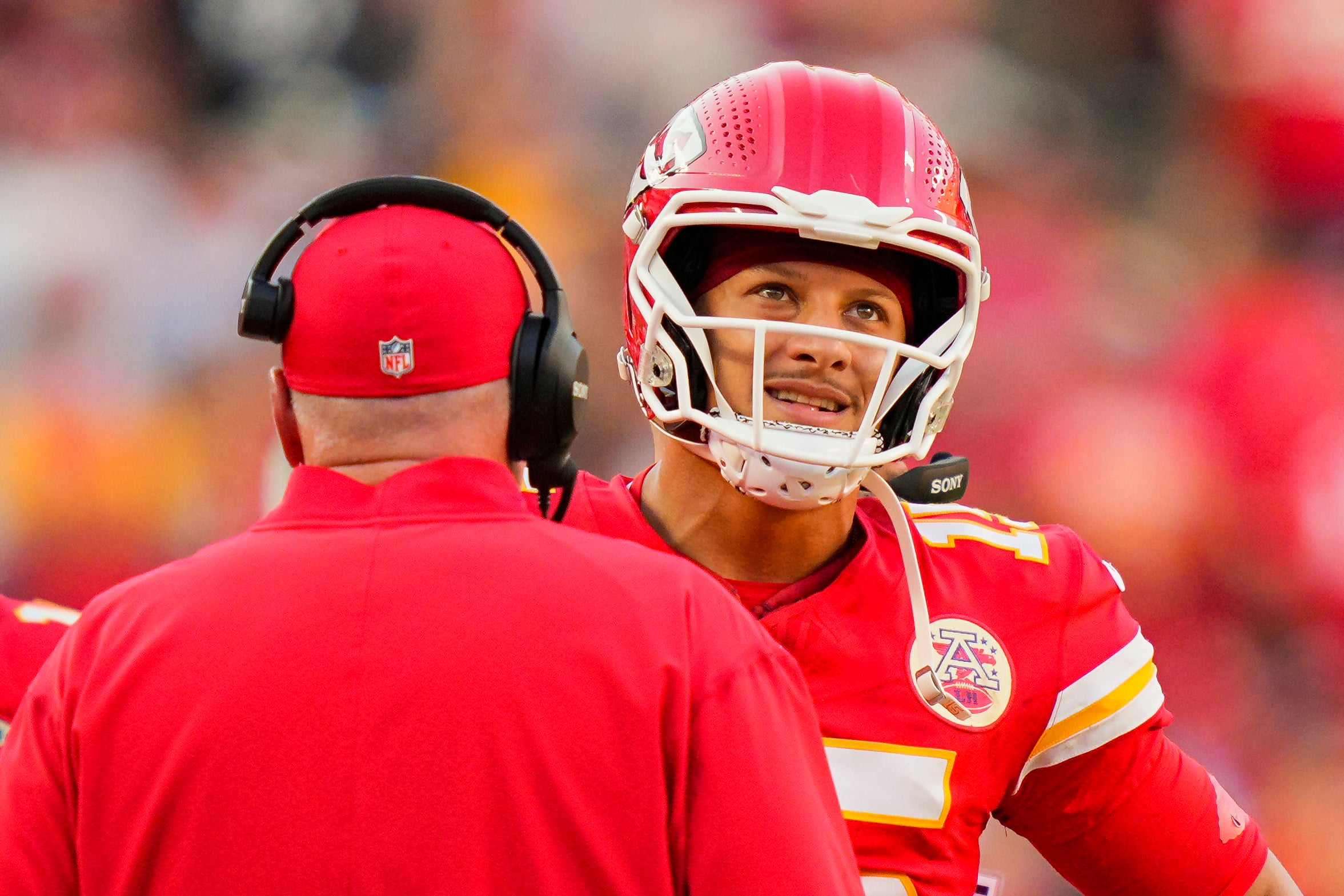Kansas City Chiefs quarterback Patrick Mahomes (15) talks with head coach Andy Reid