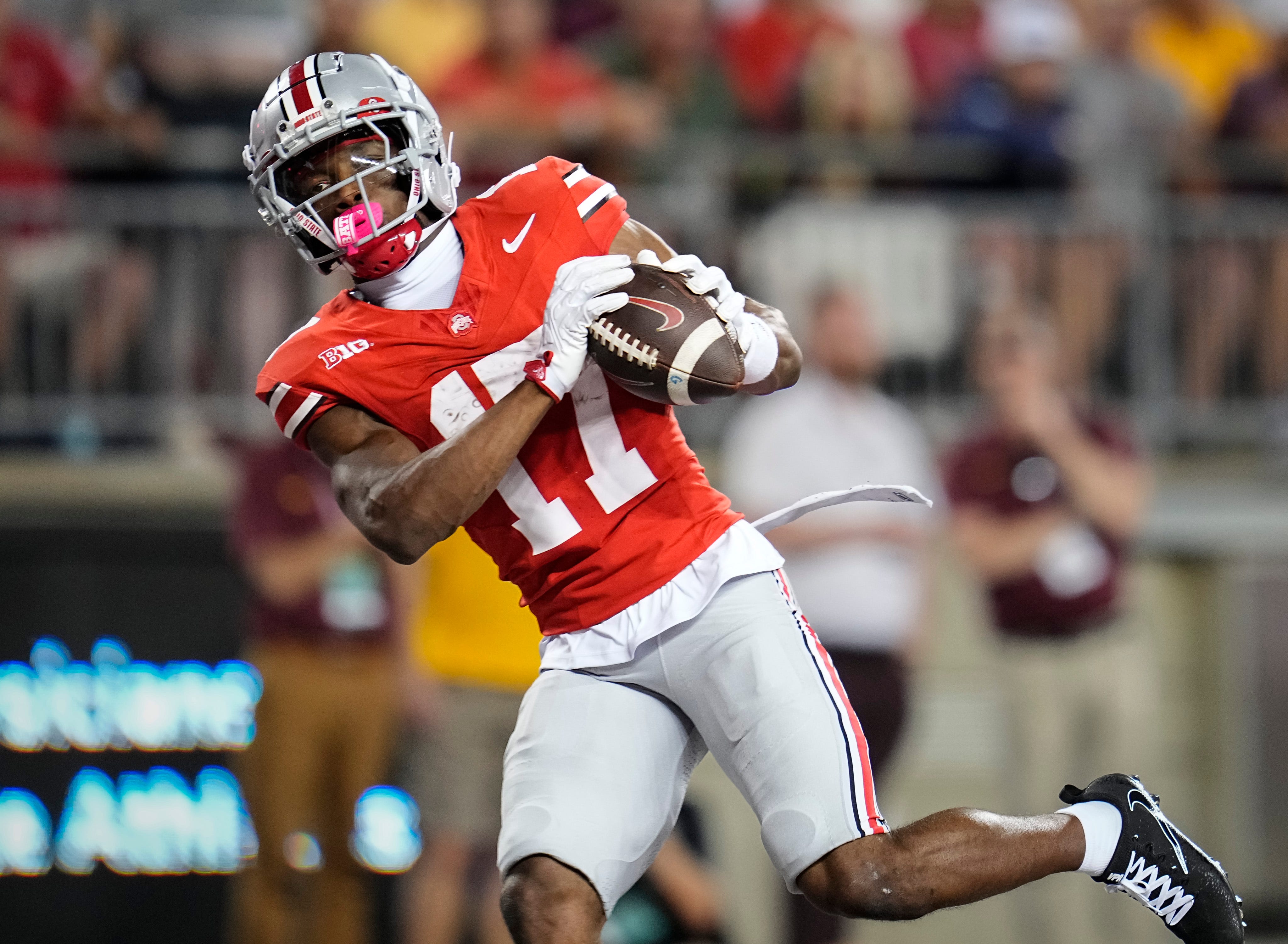 Ohio State Buckeyes wide receiver Carnell Tate (17) catches a touchdown pass during the first half of the NCAA football game against the Minnesota Golden Gophers at Ohio Stadium in Columbus on Oct. 4, 2025.