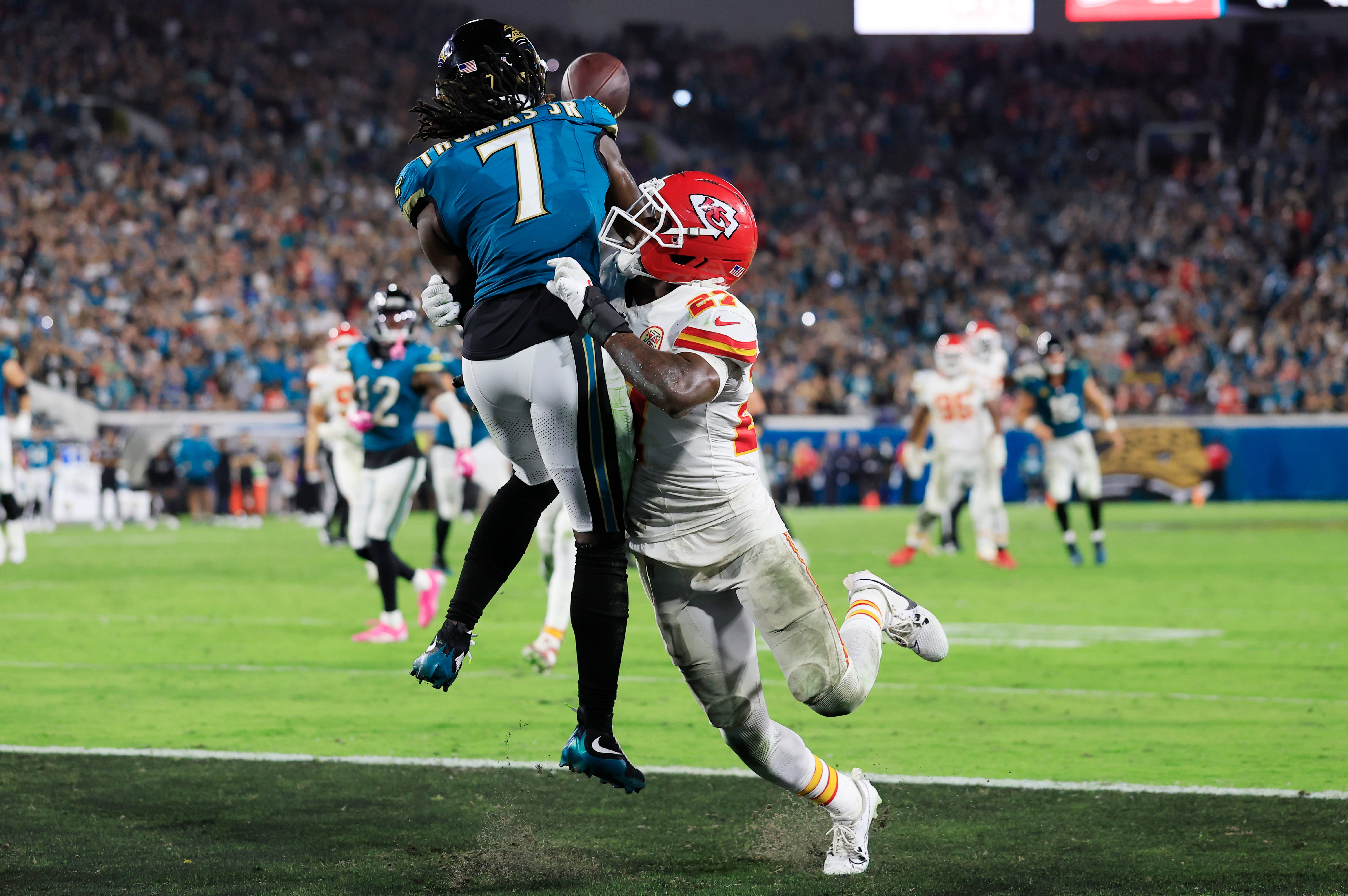 Kansas City Chiefs defensive back Chamarri Conner (27) is called for pass interference on Jacksonville Jaguars wide receiver Brian Thomas Jr. (7)