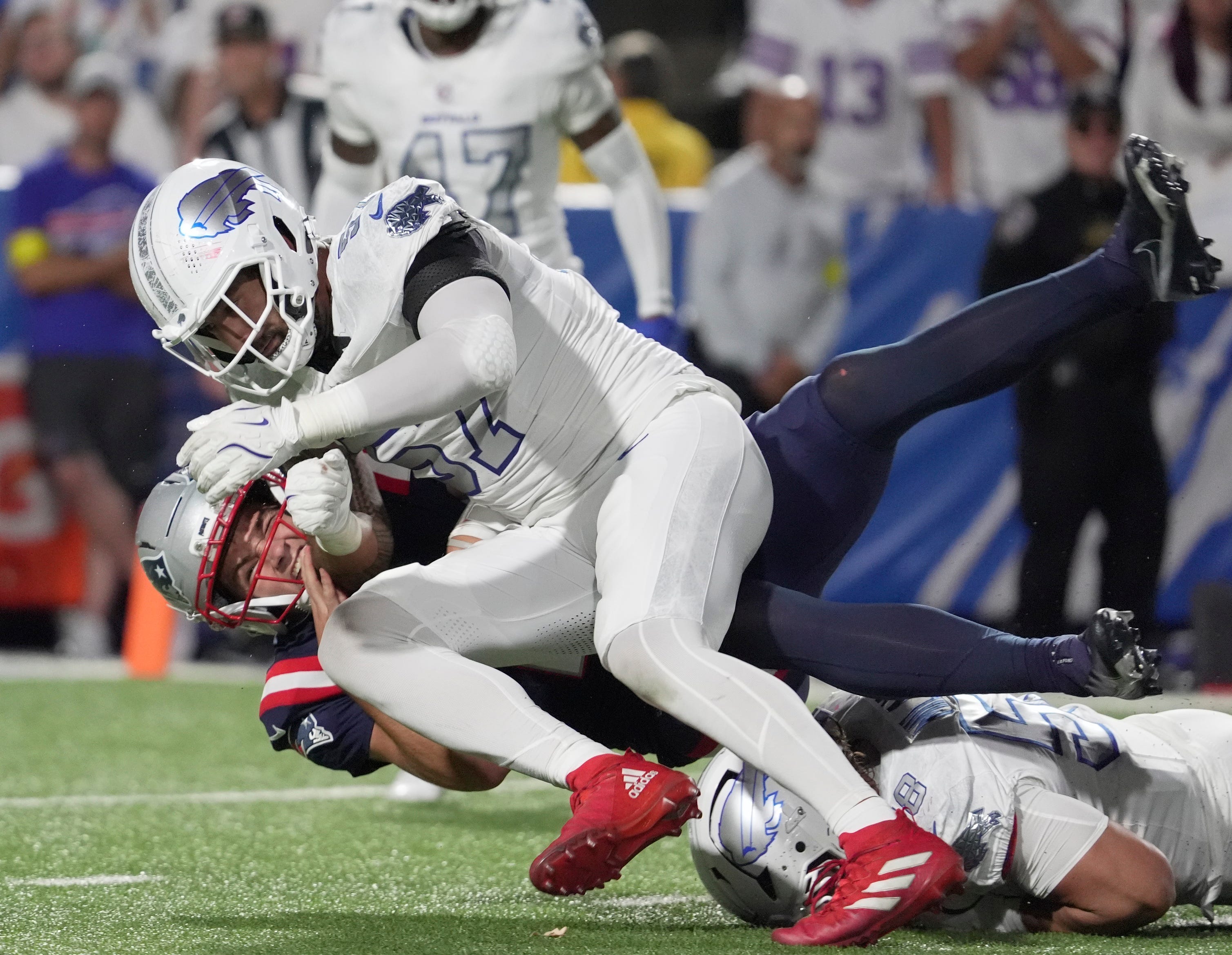 Buffalo Bills defensive end A.J. Epenesa tackles New England Patriots quarterback Drake Maye during first half action at Highmark Stadium in Orchard Park on Oct. 5, 2025.
