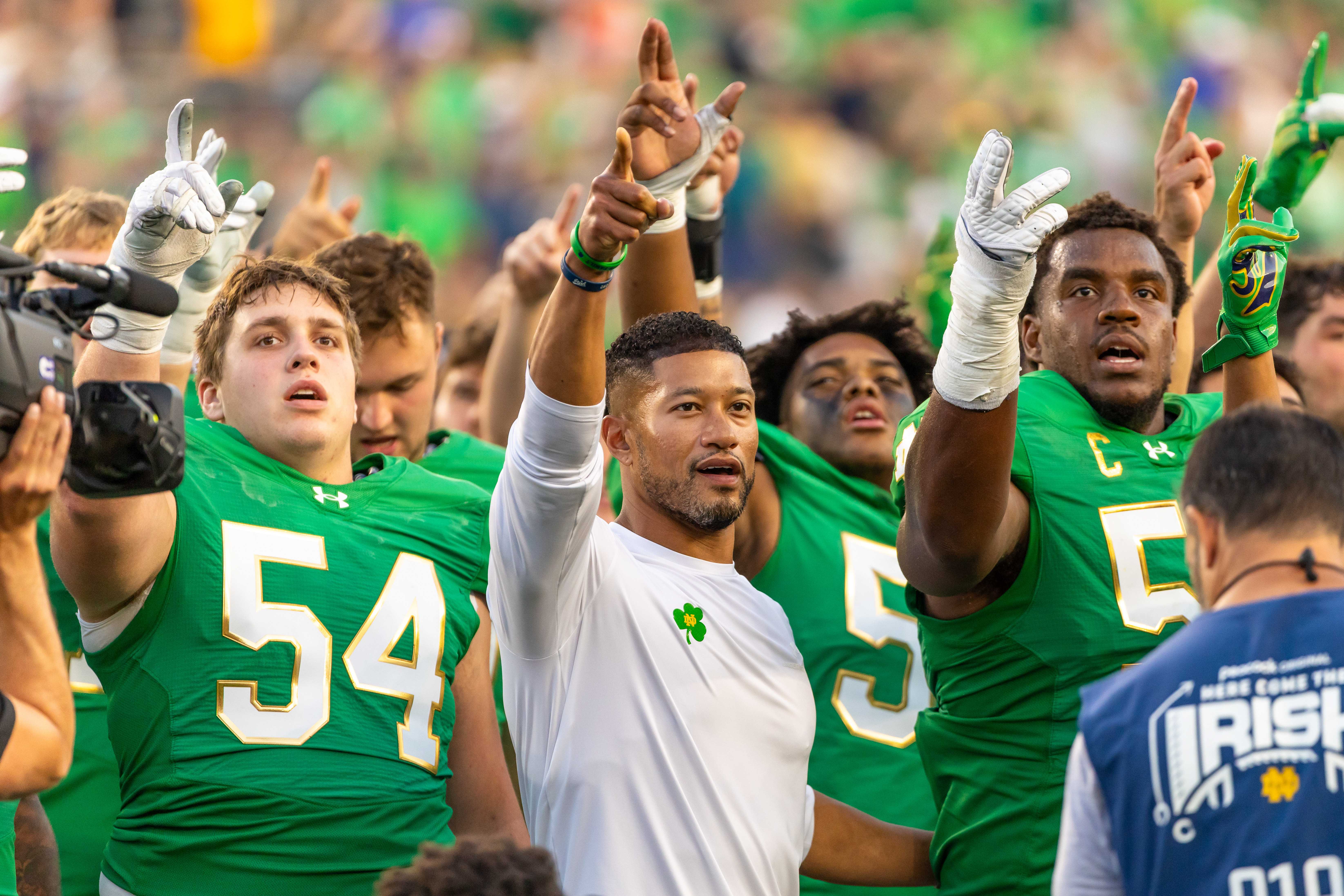 Oct 4, 2025; South Bend, Indiana, USA; Notre Dame head football coach Marcus Freeman sings the Notre Dame Alma Mater after beating the Boise State Broncos at Notre Dame Stadium. Mandatory Credit: Michael Caterina-Imagn Images