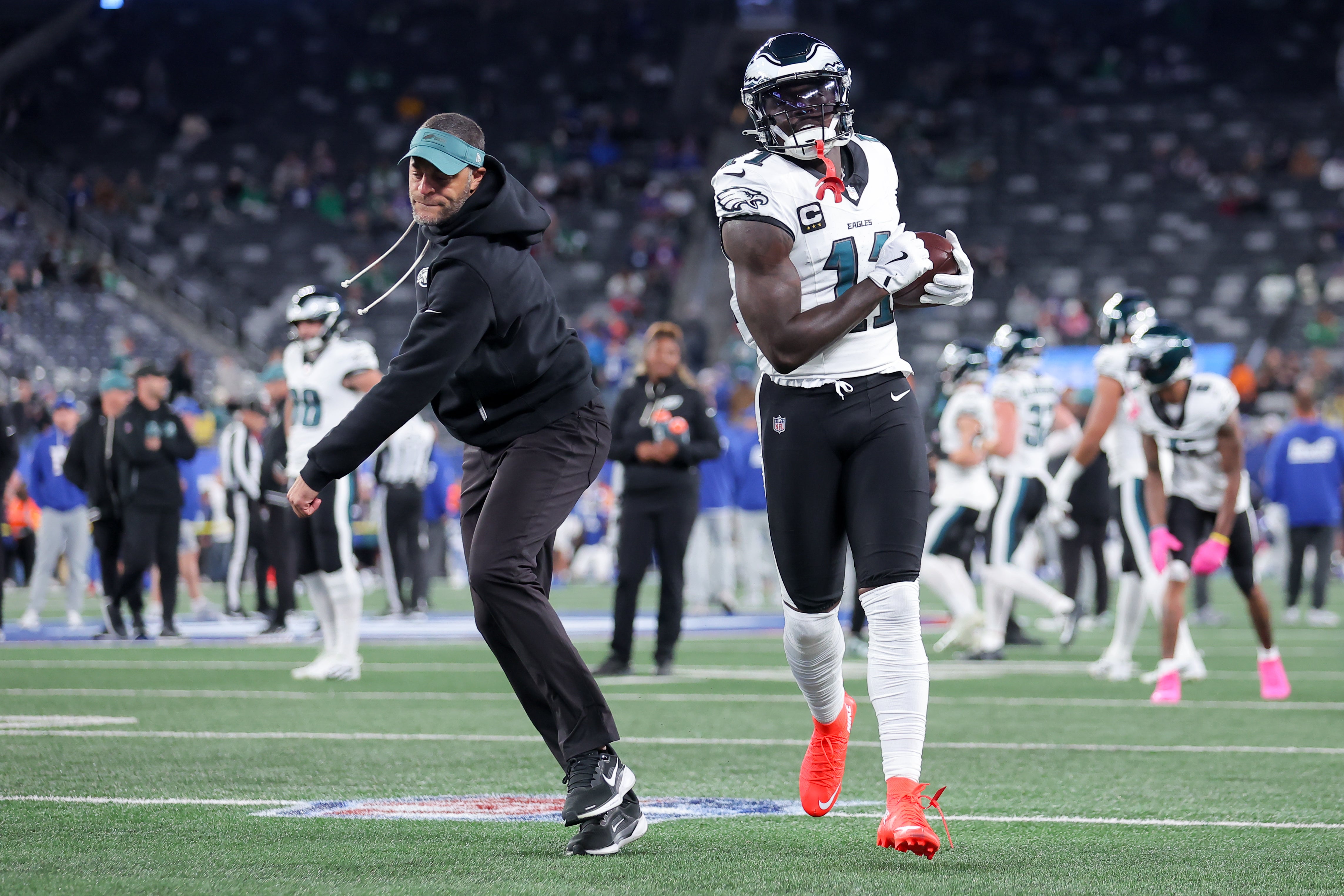 Philadelphia Eagles wide receiver A.J. Brown (11) warms up with wide recivers coach Aaron Moorehead prior to the game against the New York Giants at MetLife Stadium.