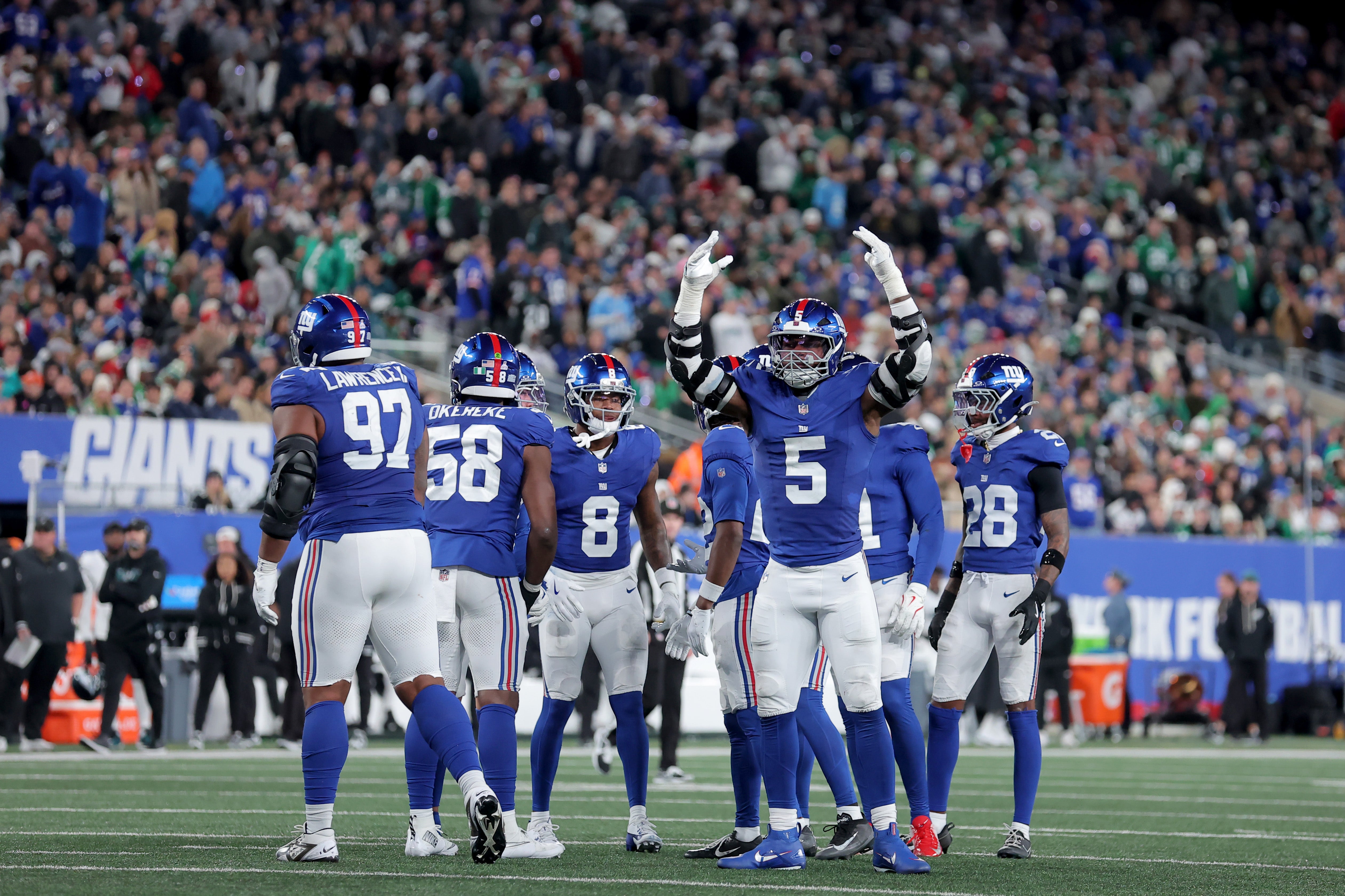 Oct 9, 2025; East Rutherford, New Jersey, USA; New York Giants linebacker Kayvon Thibodeaux (5) encourages the crowd during the third quarter against the Philadelphia Eagles at MetLife Stadium.