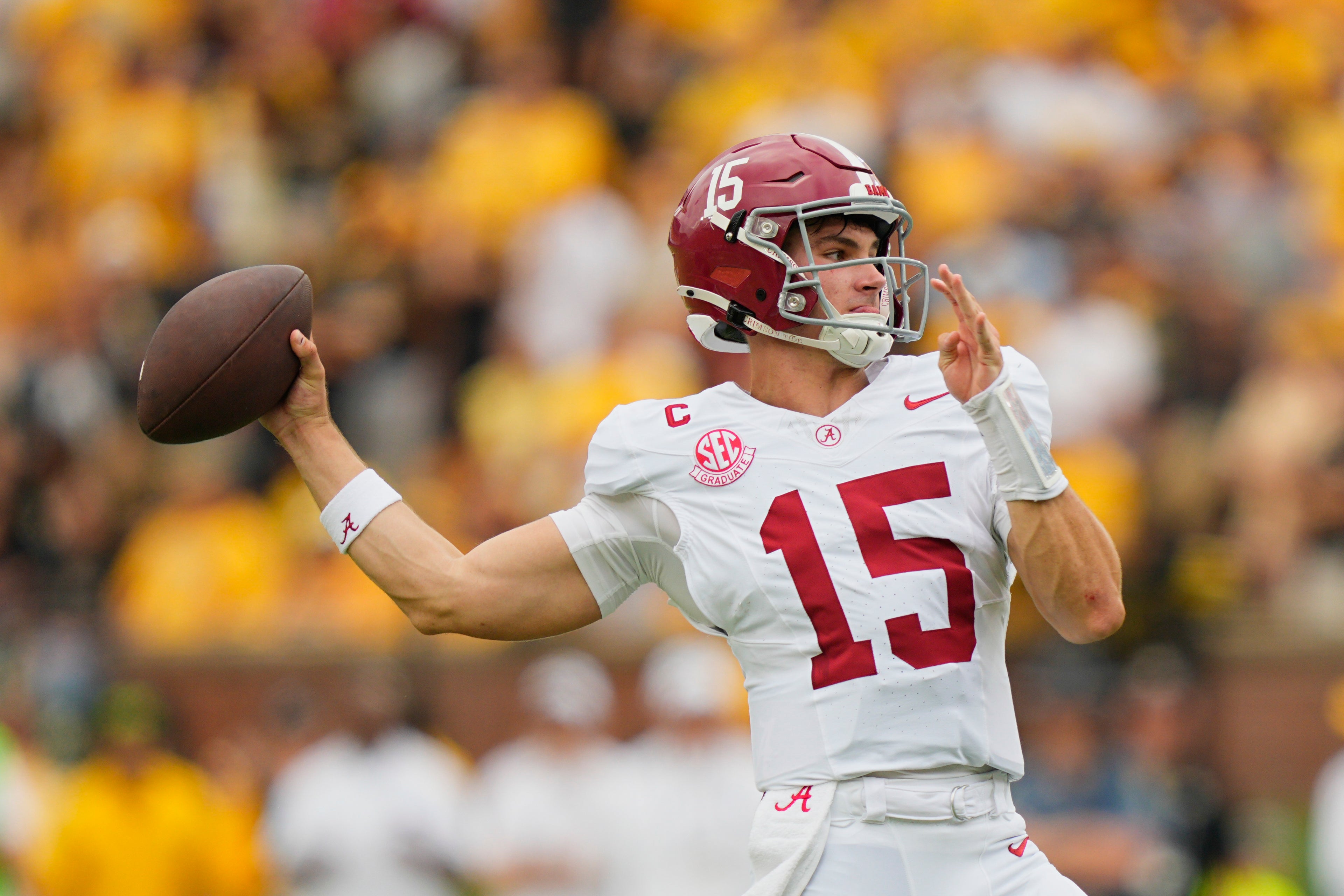 Oct 11, 2025; Columbia, Missouri, USA; Alabama Crimson Tide quarterback Ty Simpson (15) throws against the Missouri Tigers during the first half of the game at Faurot Field at Memorial Stadium.