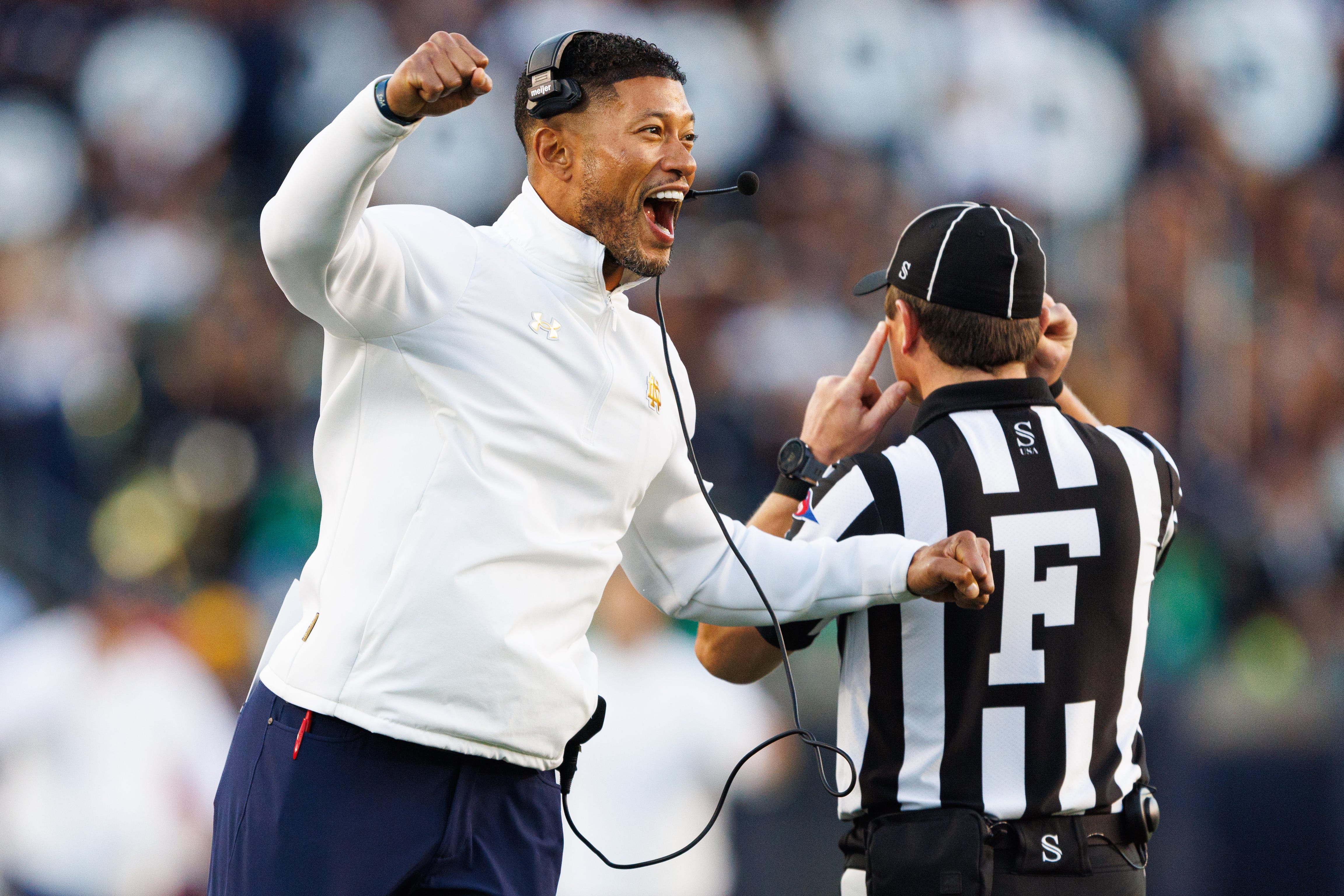Notre Dame head coach Marcus Freeman celebrates after the defense scored a safety in the second half of a NCAA football game against NC State at Notre Dame Stadium on Saturday, Oct. 11, 2025, in South Bend.