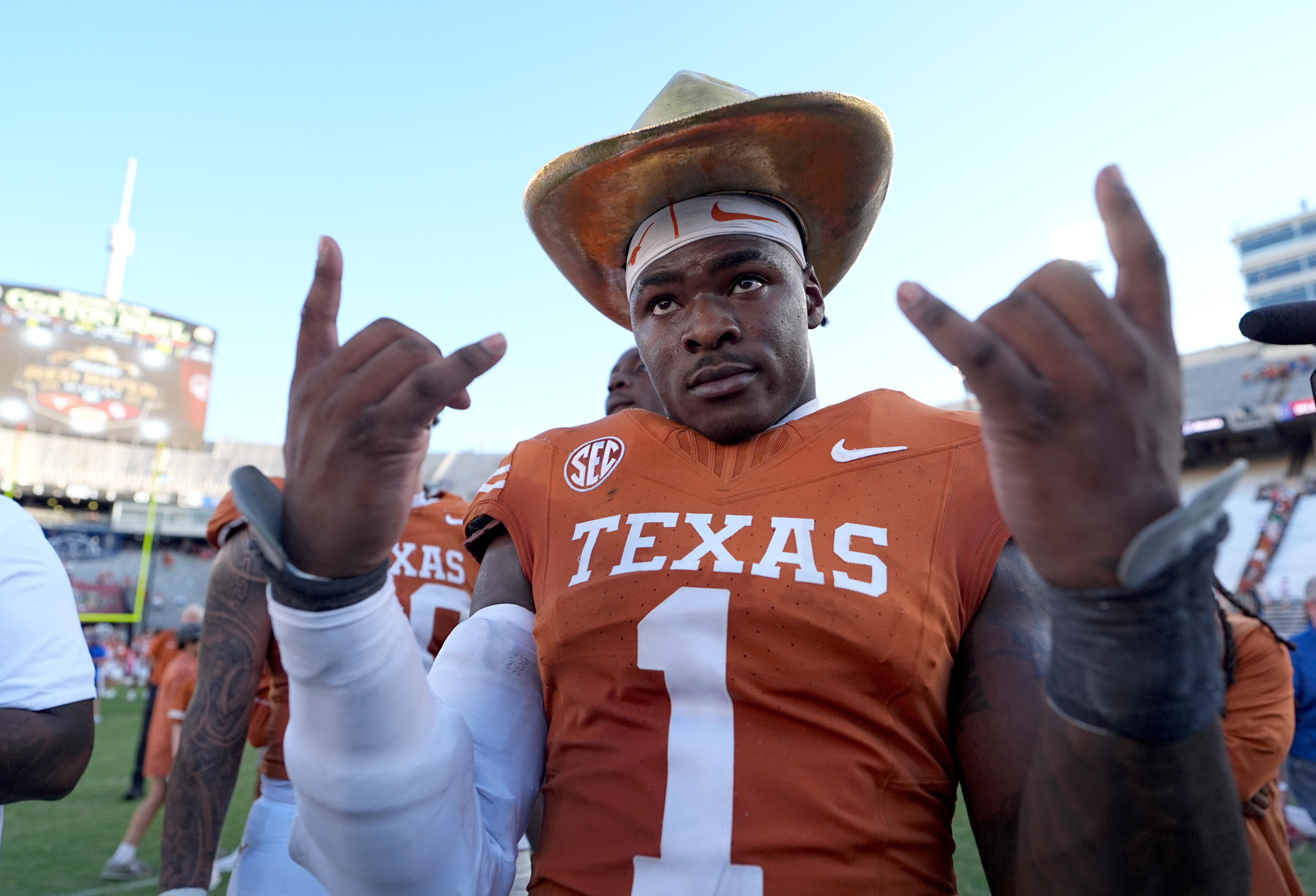 Texas Longhorns defensive end Colin Simmons (1) celebrates with the golden hat following the Red River Rivalry college football game between the University of Oklahoma Sooners and the Texas Longhorn at the Cotton Bowl Stadium in Dallas, Texas, Saturday, Oct. 11, 2025.