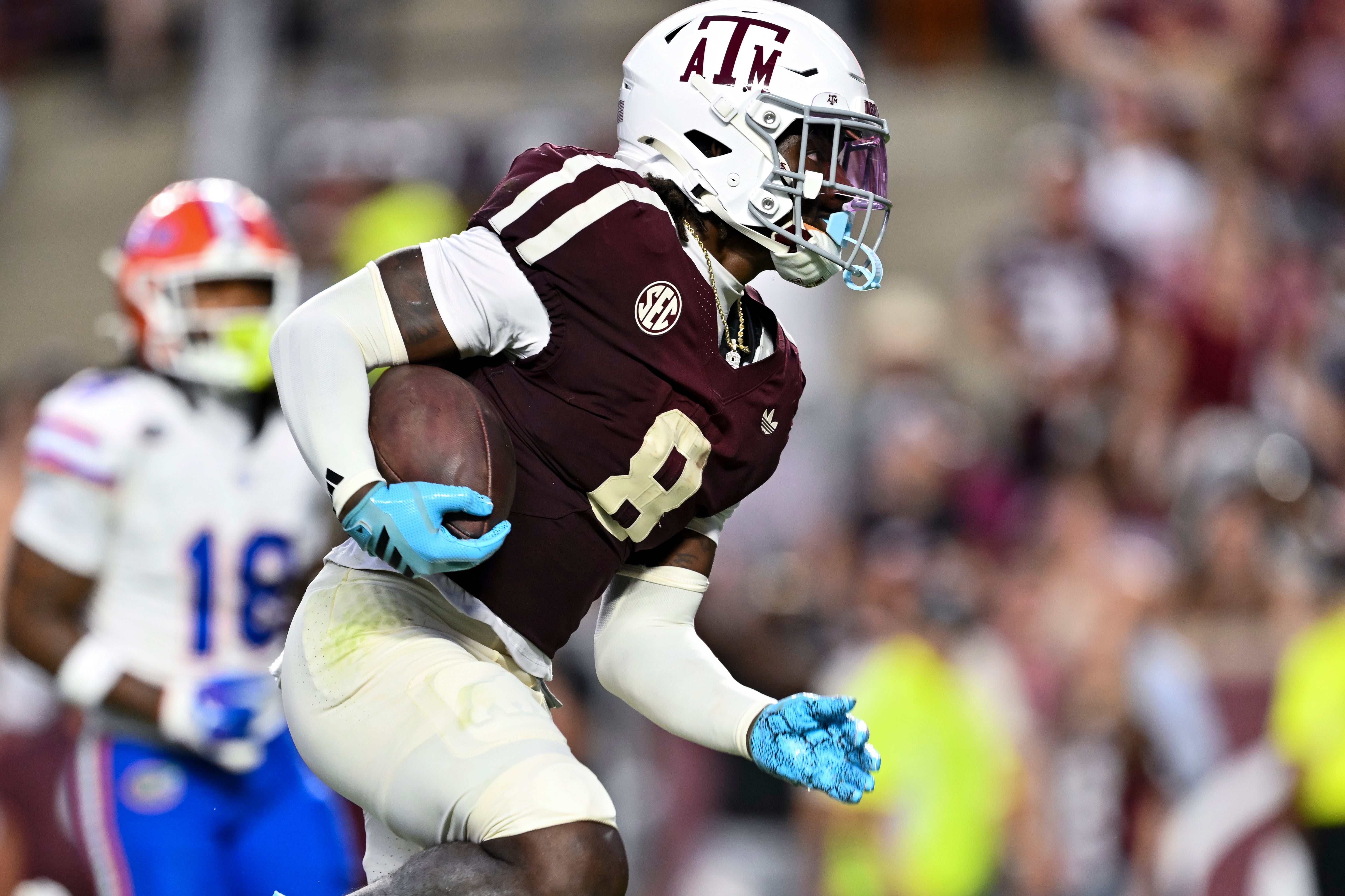 Oct 11, 2025; College Station, Texas, USA; Texas A&M Aggies running back Le'Veon Moss (8) runs the ball in for a touchdown during the second quarter against the Florida Gators at Kyle Field.