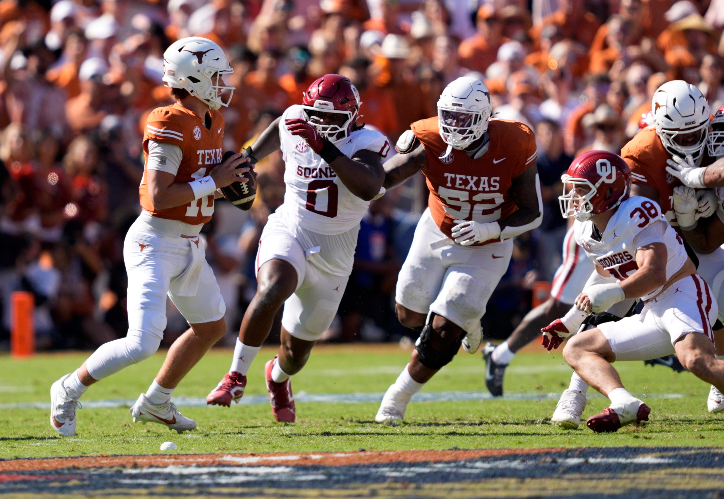 Texas Longhorns quarterback Arch Manning (16) looks to throw a pass in the first half of the Red River Rivalry college football game between the University of Oklahoma Sooners and the Texas Longhorn at the Cotton Bowl Stadium in Dallas, Texas, Saturday, Oct. 11, 2025.