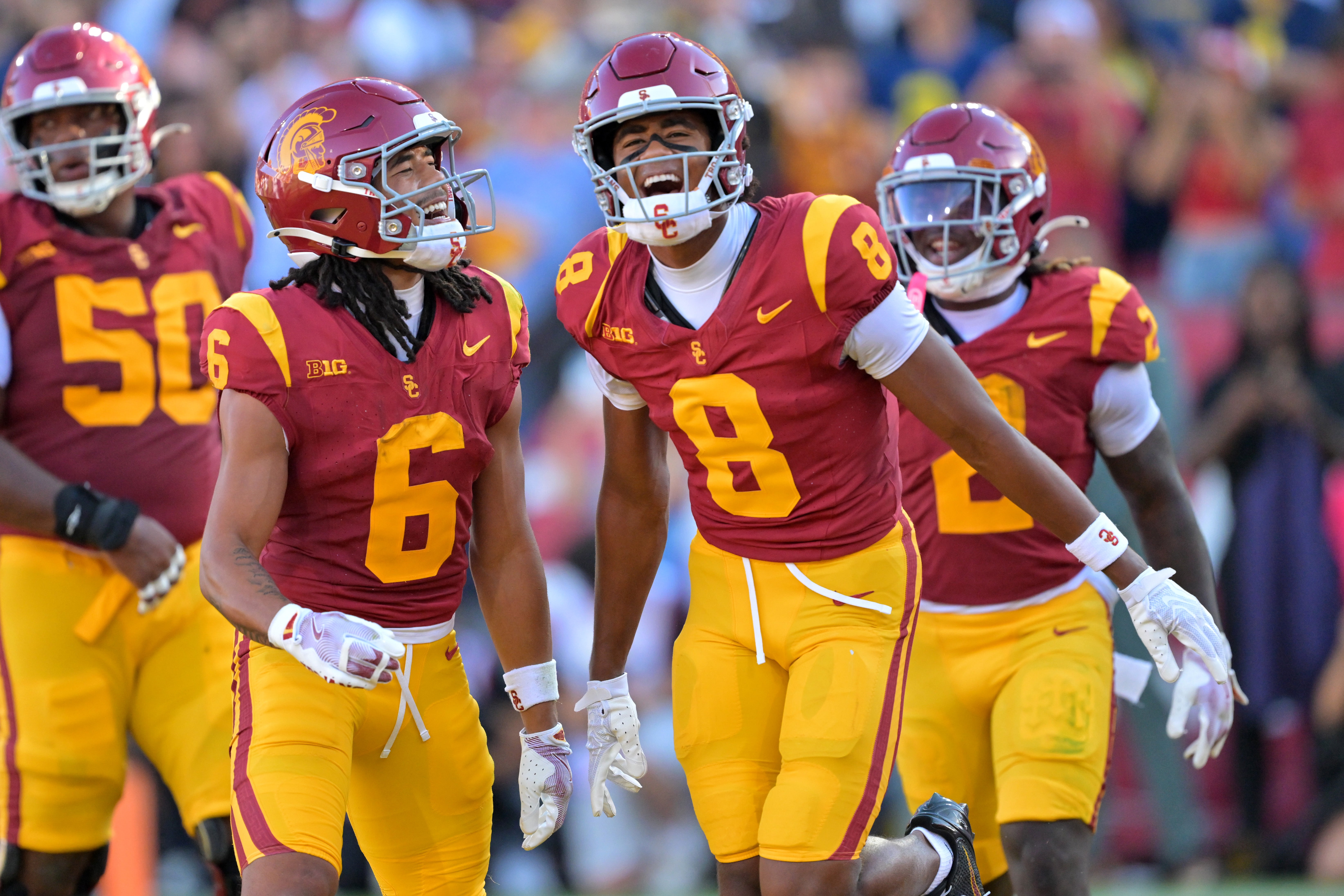 Oct 11, 2025; Los Angeles, California, USA; USC Trojans wide receiver Ja'Kobi Lane (8) is congratulated by wide receiver Makai Lemon (6) after catching a touchdown pass in the first half against the Michigan Wolverines at United Airlines Field at the Los Angeles Memorial Coliseum. Mandatory Credit: Jayne Kamin-Oncea-Imagn Images