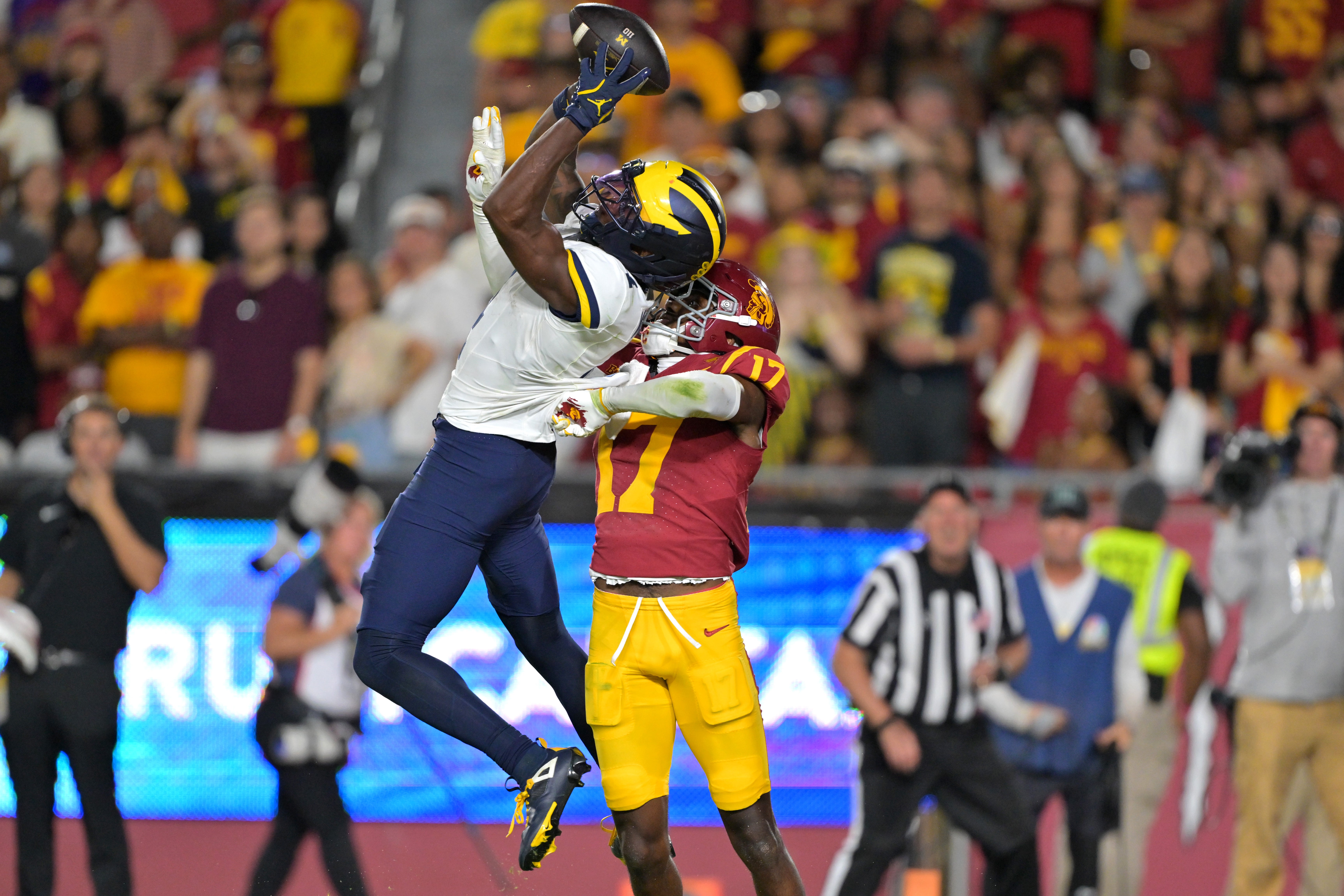 Oct 11, 2025; Los Angeles, California, USA; USC Trojans cornerback Decarlos Nicholson (17) breaks up a pass in the end zone for Michigan Wolverines wide receiver Andrew Marsh (4) in the second half at United Airlines Field at the Los Angeles Memorial Coliseum.