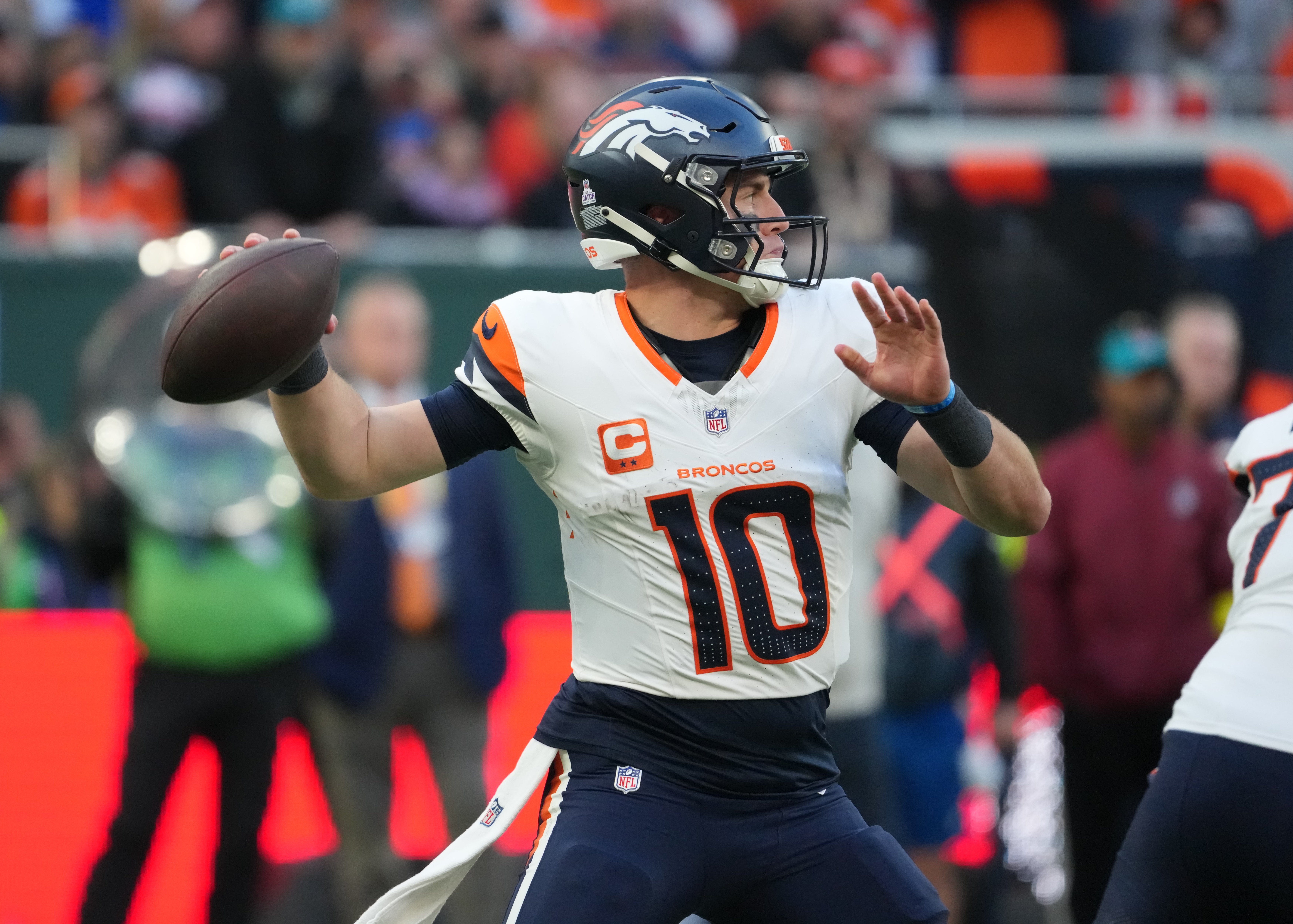 Oct 12, 2025; Tottenham, United Kingdom; Denver Broncos quarterback Bo Nix (10) throws a pass against the New York Jets during an NFL International Series game at Tottenham Hotspur Stadium.
