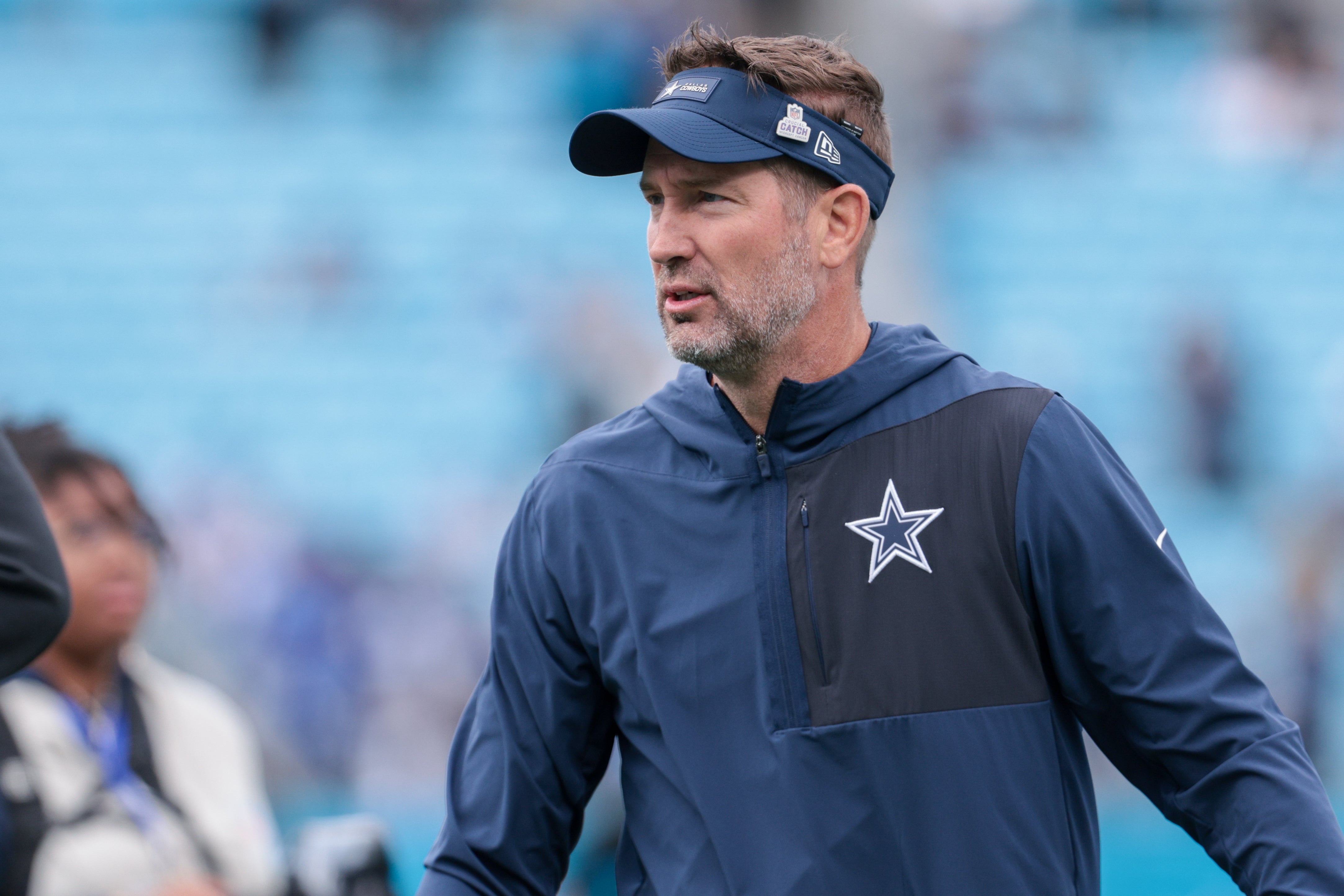 Oct 12, 2025; Charlotte, North Carolina, USA; Dallas Cowboys head coach Brian Schottenheimer looks on before the game against the Carolina Panthers at Bank of America Stadium.