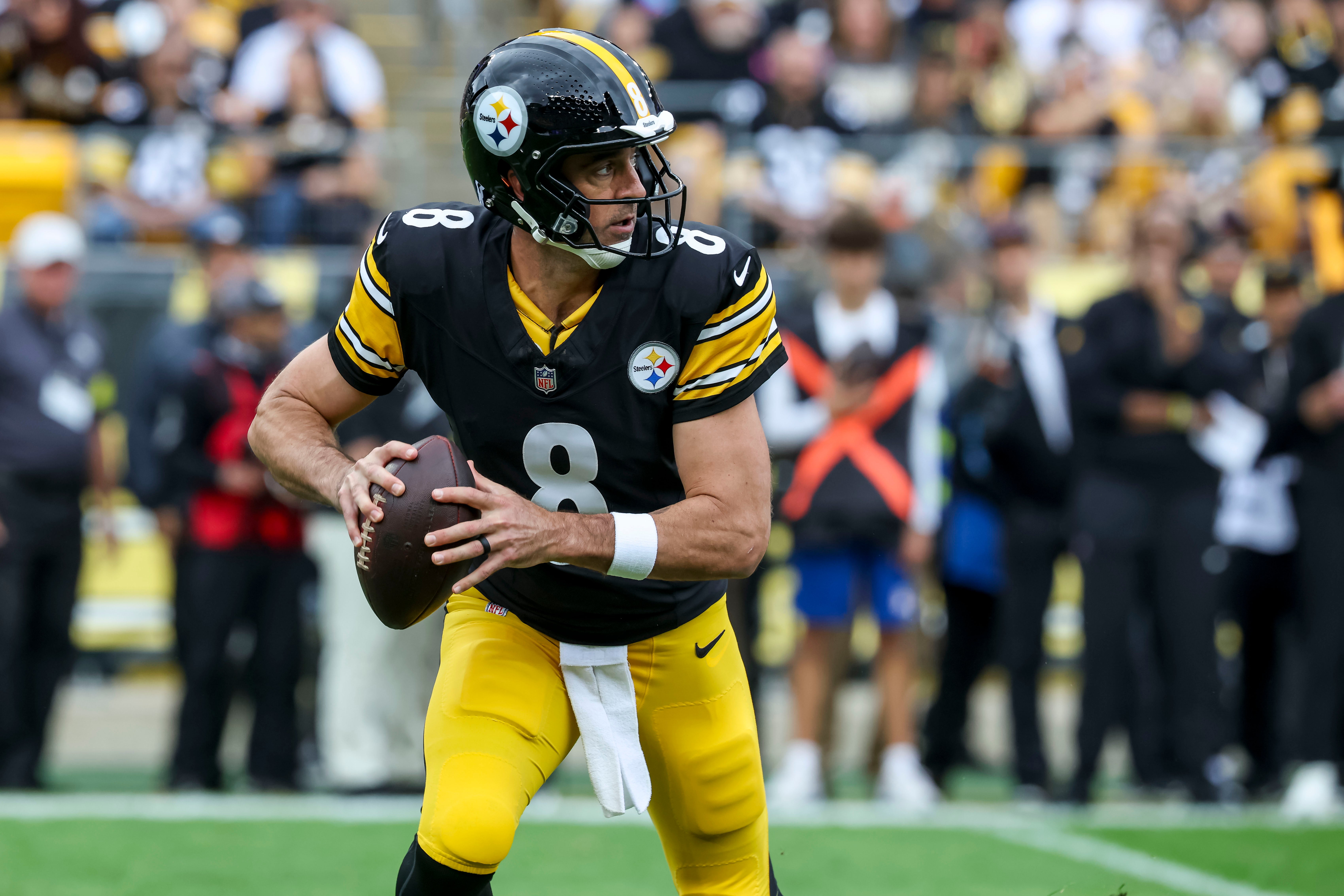 Oct 12, 2025; Pittsburgh, Pennsylvania, USA; Pittsburgh Steelers quarterback Aaron Rodgers (8) looks to complete a pass during the first quarter at Acrisure Stadium.