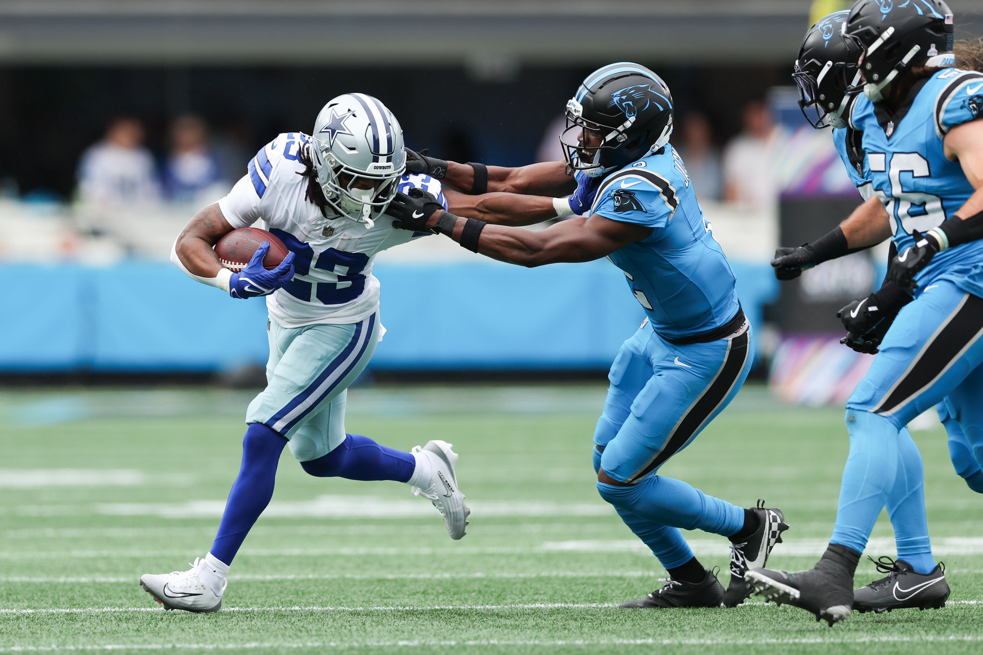 Oct 12, 2025; Charlotte, North Carolina, USA; Dallas Cowboys running back Jaydon Blue (23) runs with the ball during the second quarter against the Carolina Panthers at Bank of America Stadium.