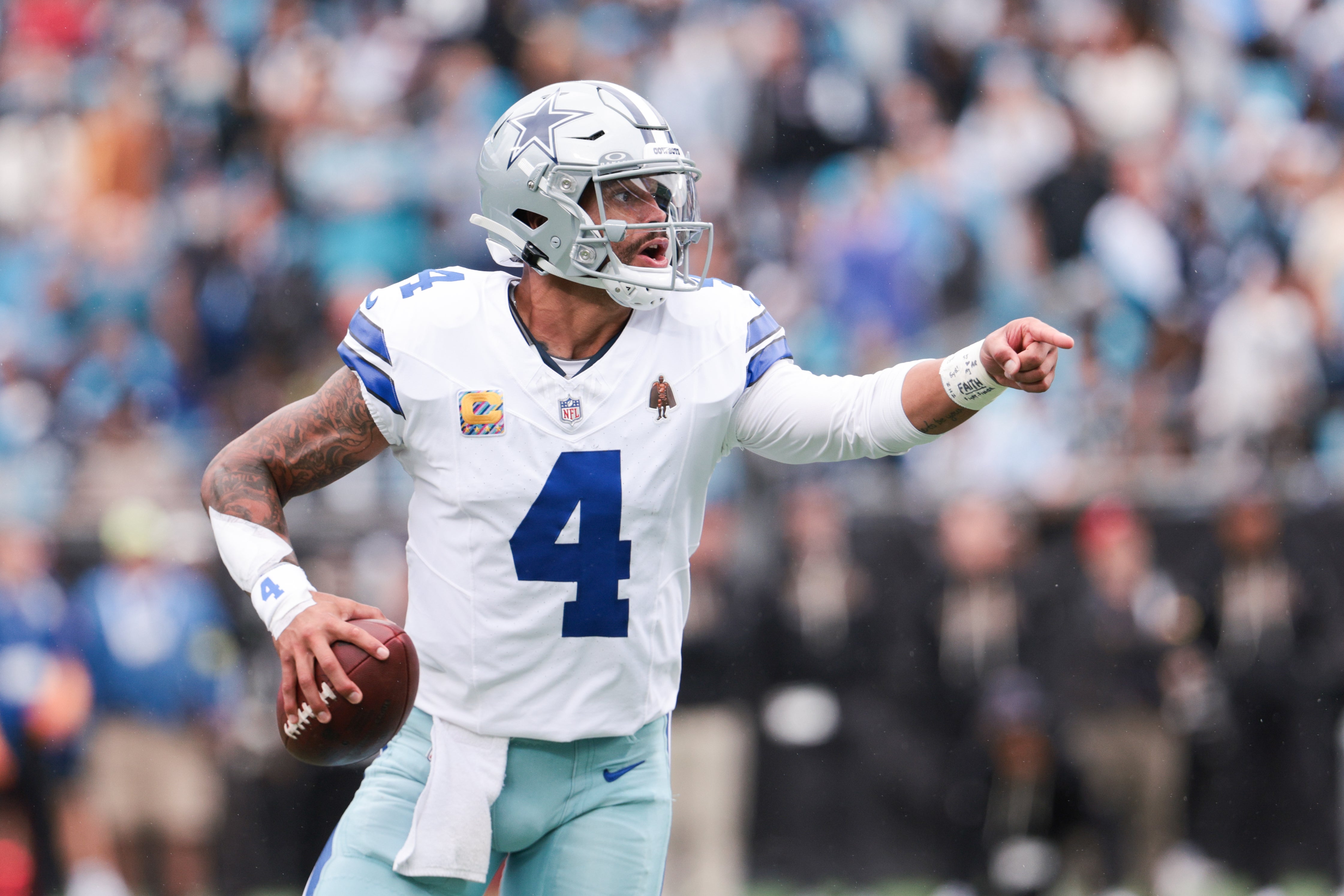 Oct 12, 2025; Charlotte, North Carolina, USA; Dallas Cowboys quarterback Dak Prescott (4) communicates during the second half against the Carolina Panthers at Bank of America Stadium.