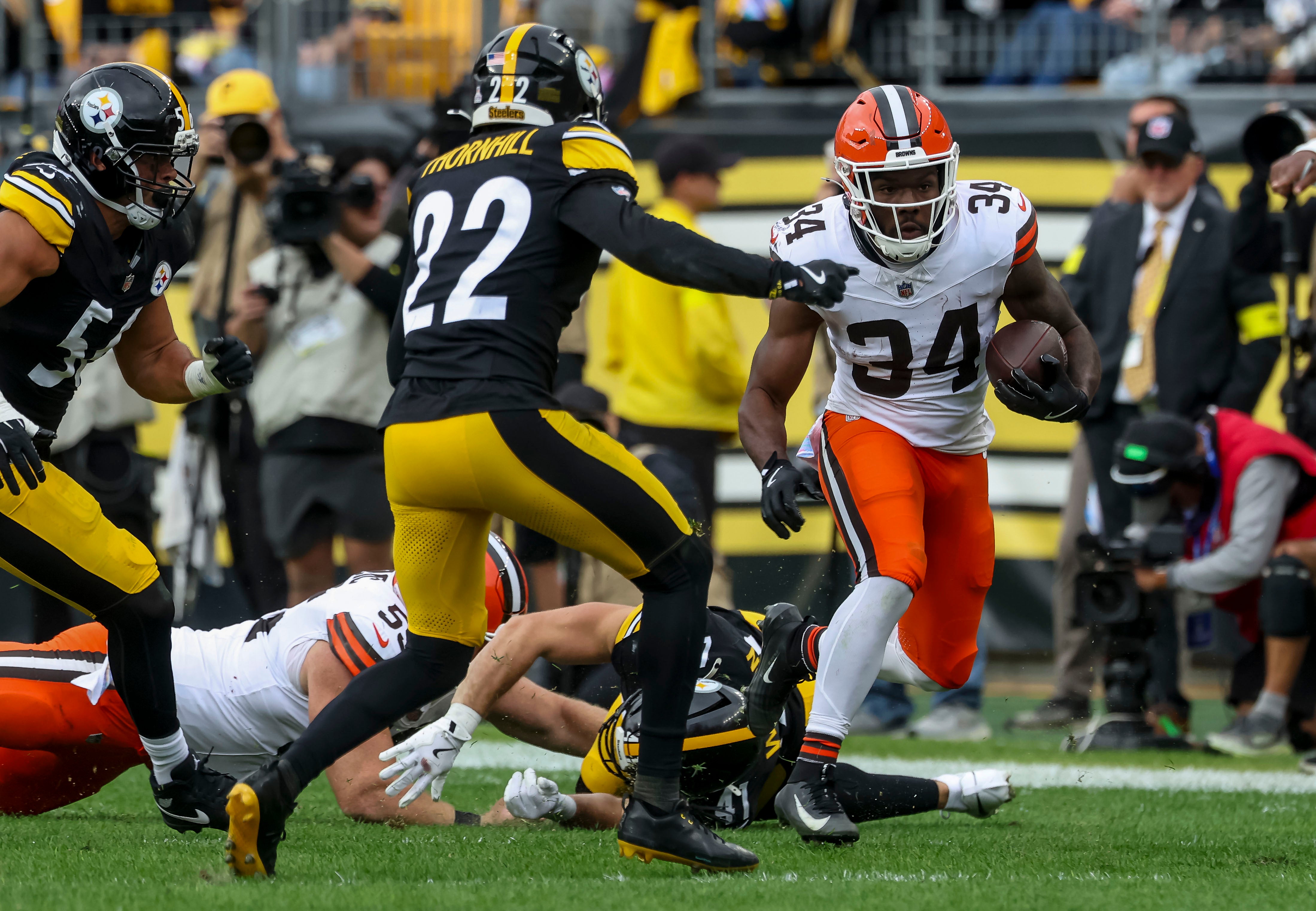 Oct 12, 2025; Pittsburgh, Pennsylvania, USA; Cleveland Browns running back Jerome Ford (34) attempts to run the ball during the second quarter at Acrisure Stadium. Mandatory Credit: Charles LeClaire-Imagn Images
