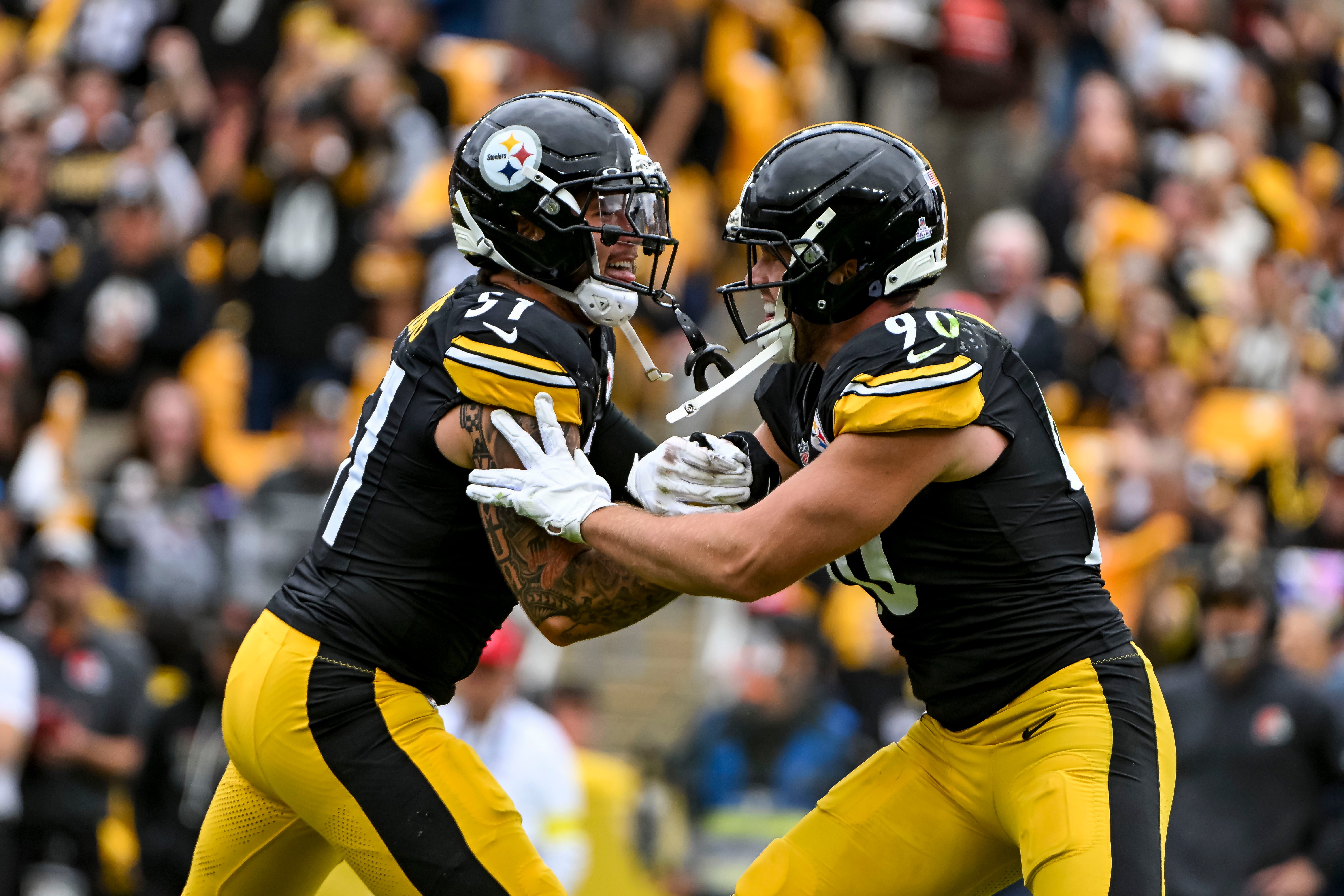 Oct 12, 2025; Pittsburgh, Pennsylvania, USA; Pittsburgh Steelers outside linebacker T.J. Watt (90) and Pittsburgh Steelers linebacker Nick Herbig (51) reacts during the second quarter at Acrisure Stadium.
