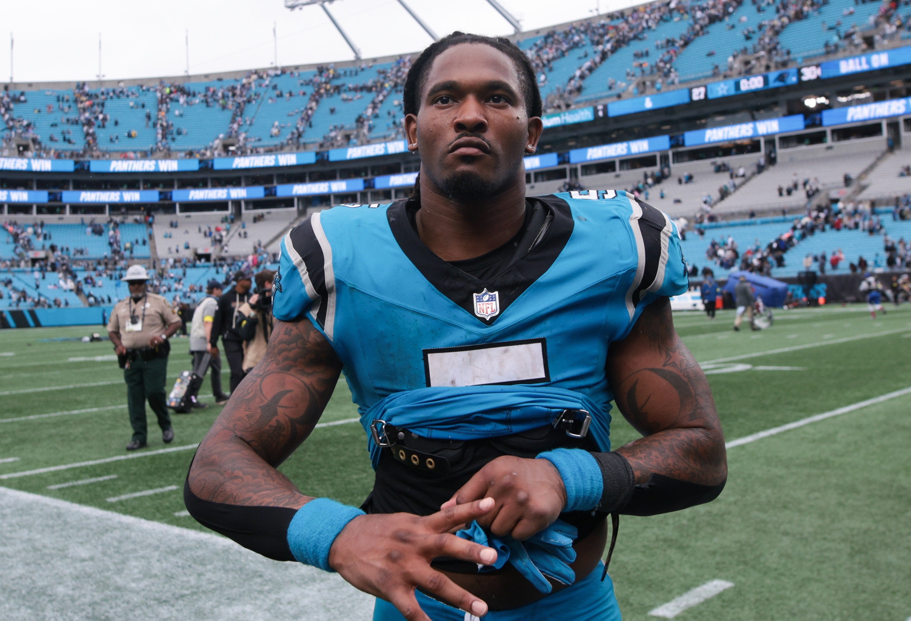 Oct 12, 2025; Charlotte, North Carolina, USA; Carolina Panthers running back Rico Dowdle (5) looks on after the game against the Dallas Cowboys at Bank of America Stadium.