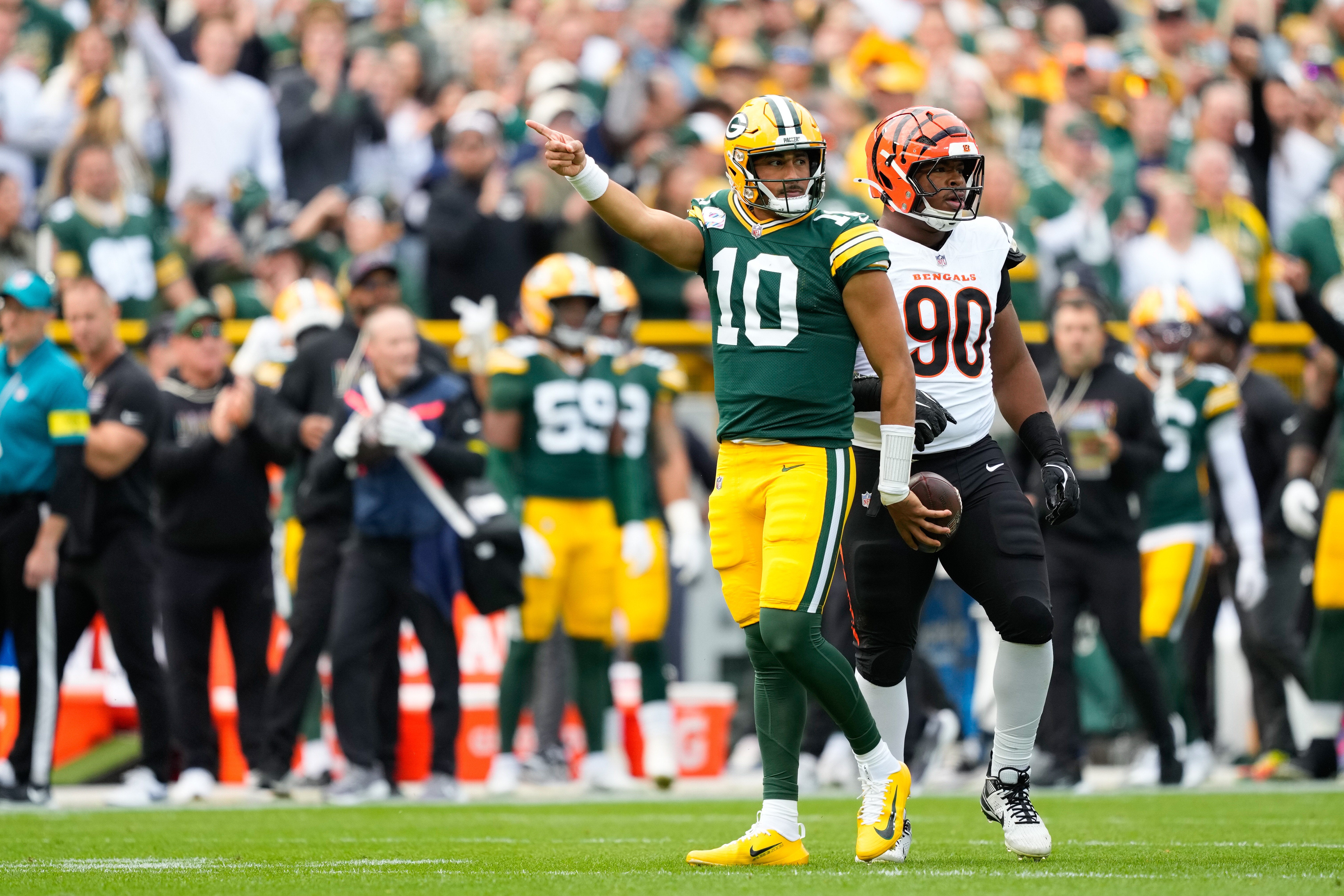 Oct 12, 2025; Green Bay, Wisconsin, USA; Green Bay Packers quarterback Jordan Love (10) reacts after getting a first down in the first quarter against Cincinnati Bengals at Lambeau Field.