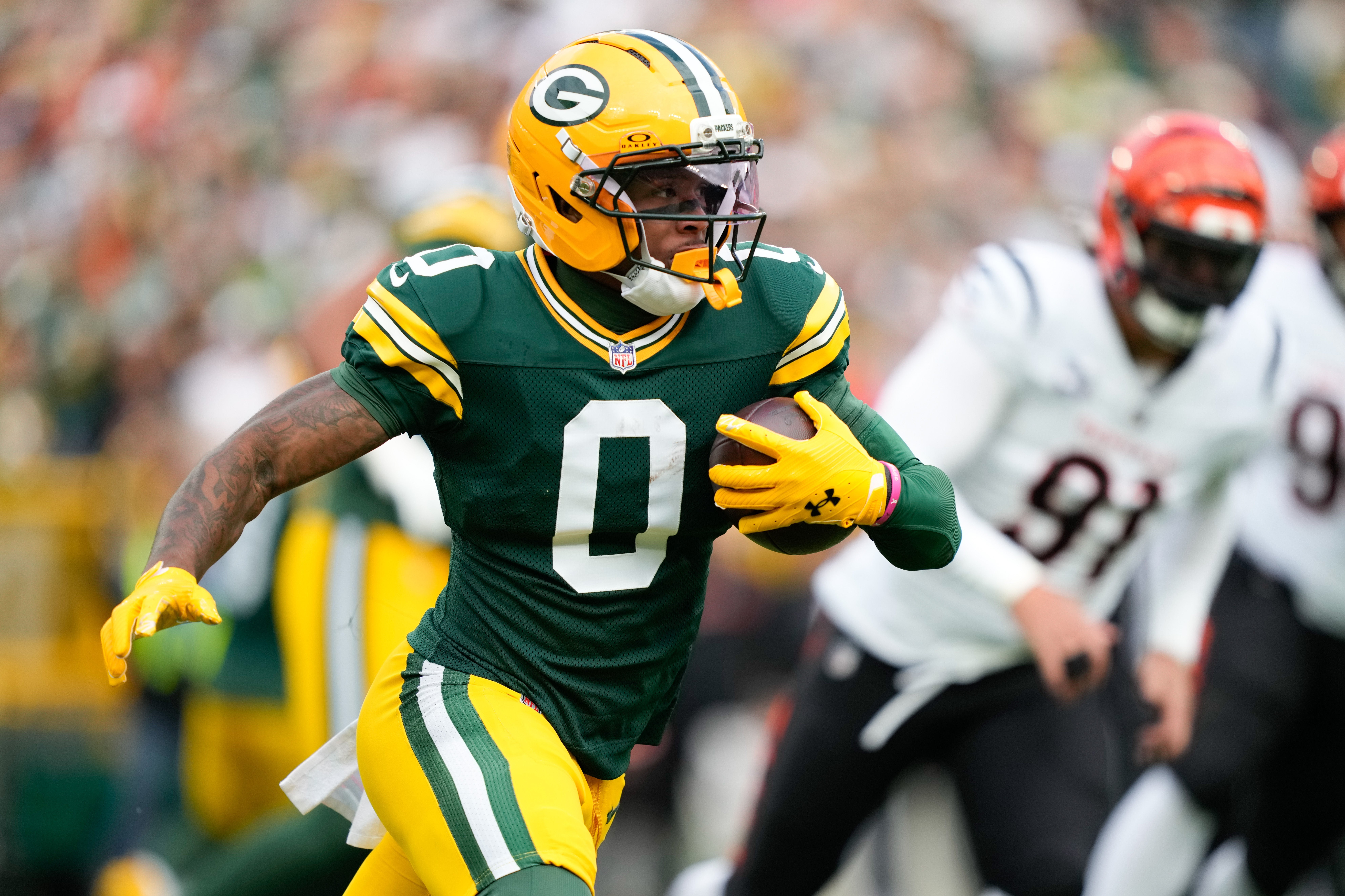 Oct 12, 2025; Green Bay, Wisconsin, USA; Green Bay Packers wide receiver Matthew Golden (0) runs with the ball during the first quarter against the Cincinnati Bengals at Lambeau Field.