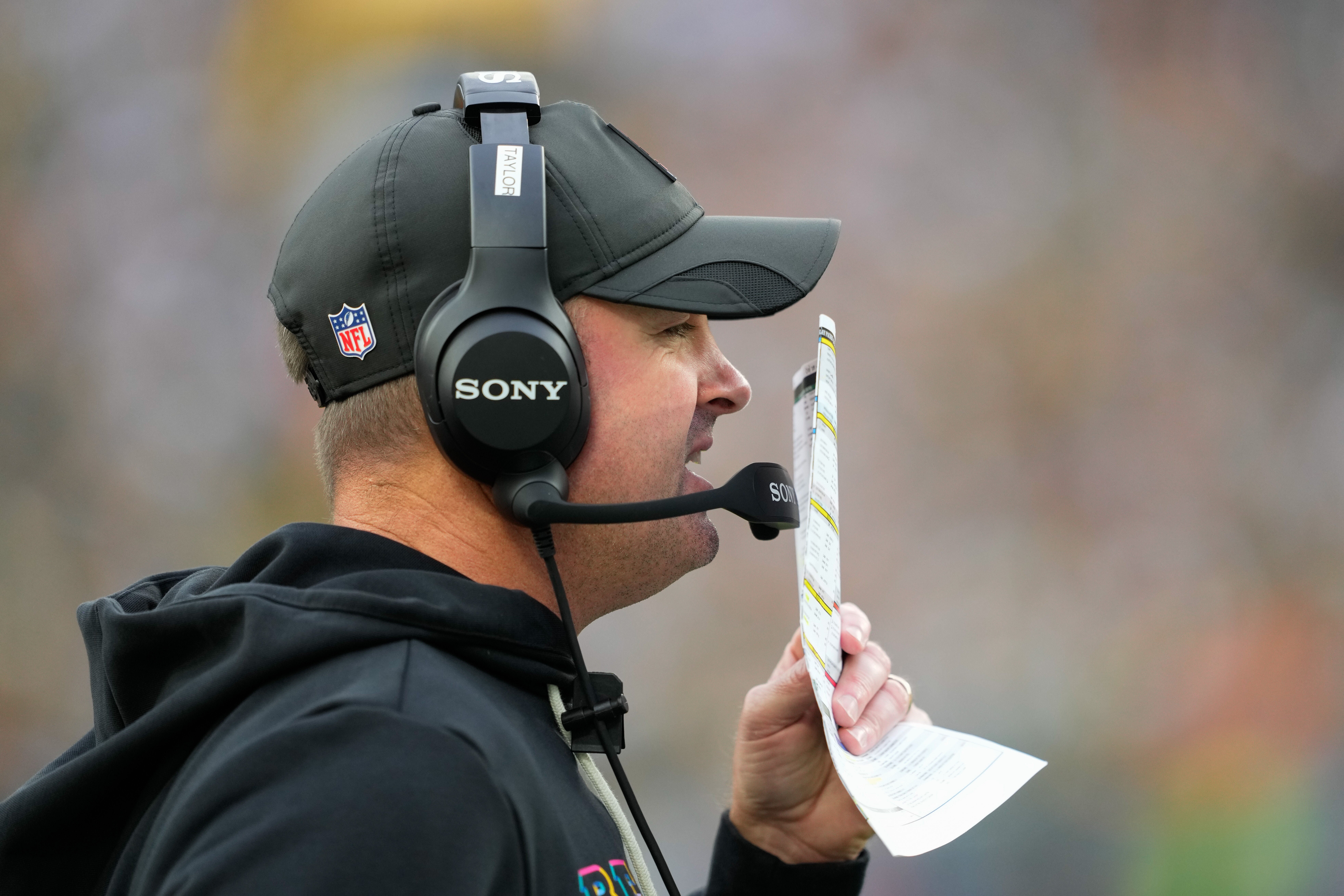 Oct 12, 2025; Green Bay, Wisconsin, USA; Cincinnati Bengals head coach Zac Taylor communicates from the sidelines during the second quarter against the Green Bay Packers at Lambeau Field.