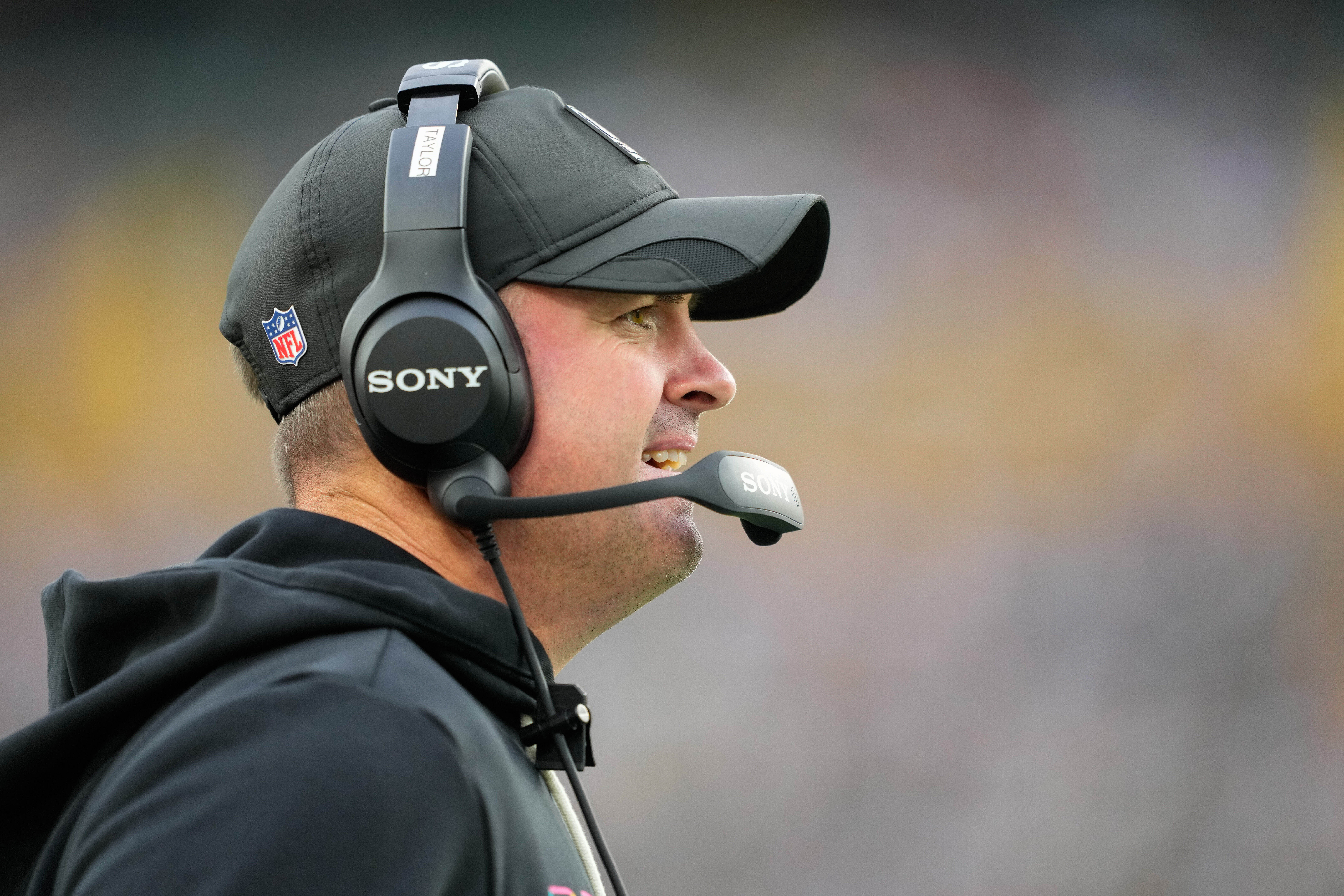 Oct 12, 2025; Green Bay, Wisconsin, USA; Cincinnati Bengals head coach Zac Taylor communicates from the sidelines during the second quarter against the Green Bay Packers at Lambeau Field.