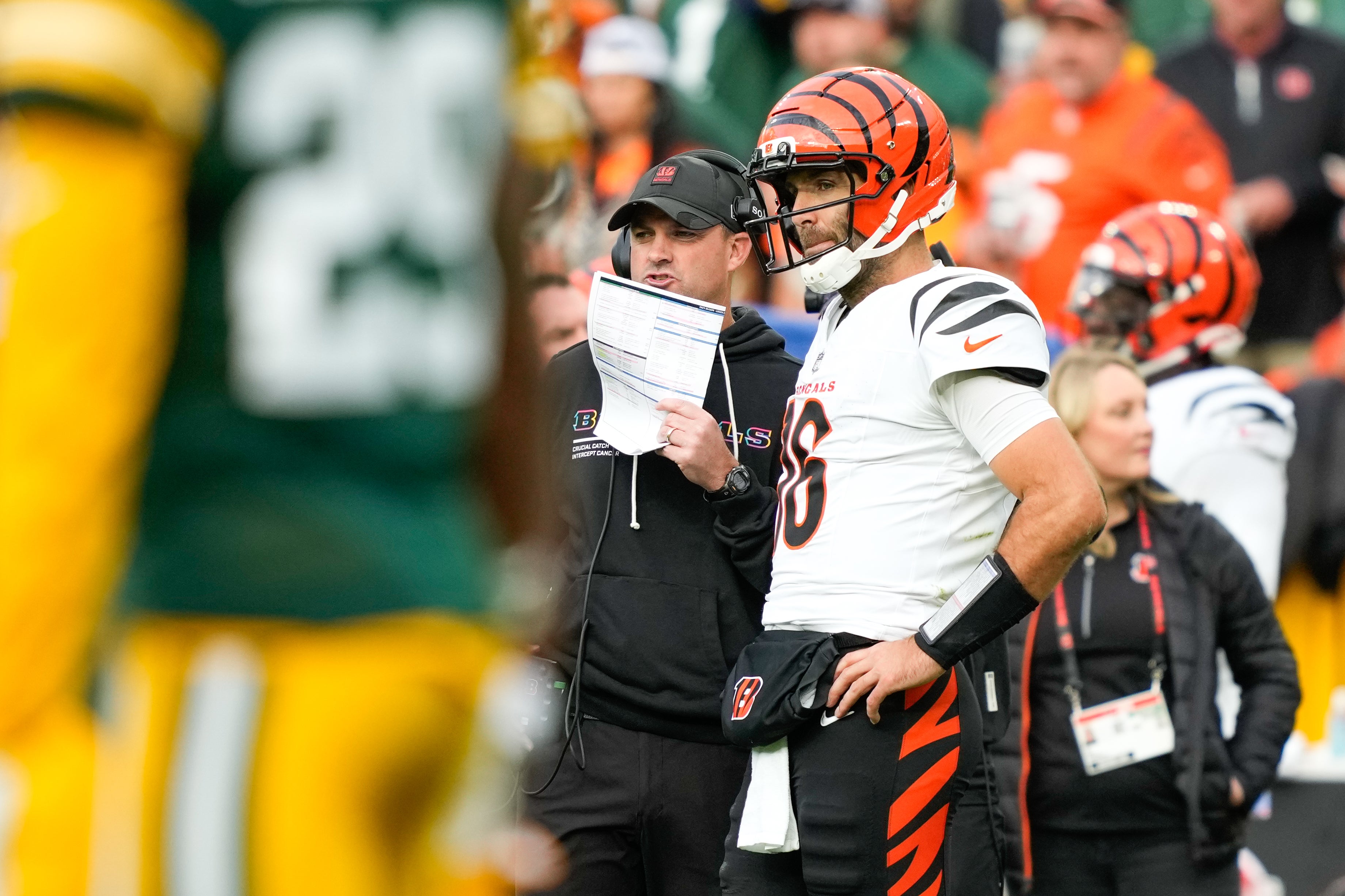 Oct 12, 2025; Green Bay, Wisconsin, USA; Cincinnati Bengals head coach Zac Taylor speaks with quarterback Joe Flacco (16) during the third quarter against the Green Bay Packers at Lambeau Field.