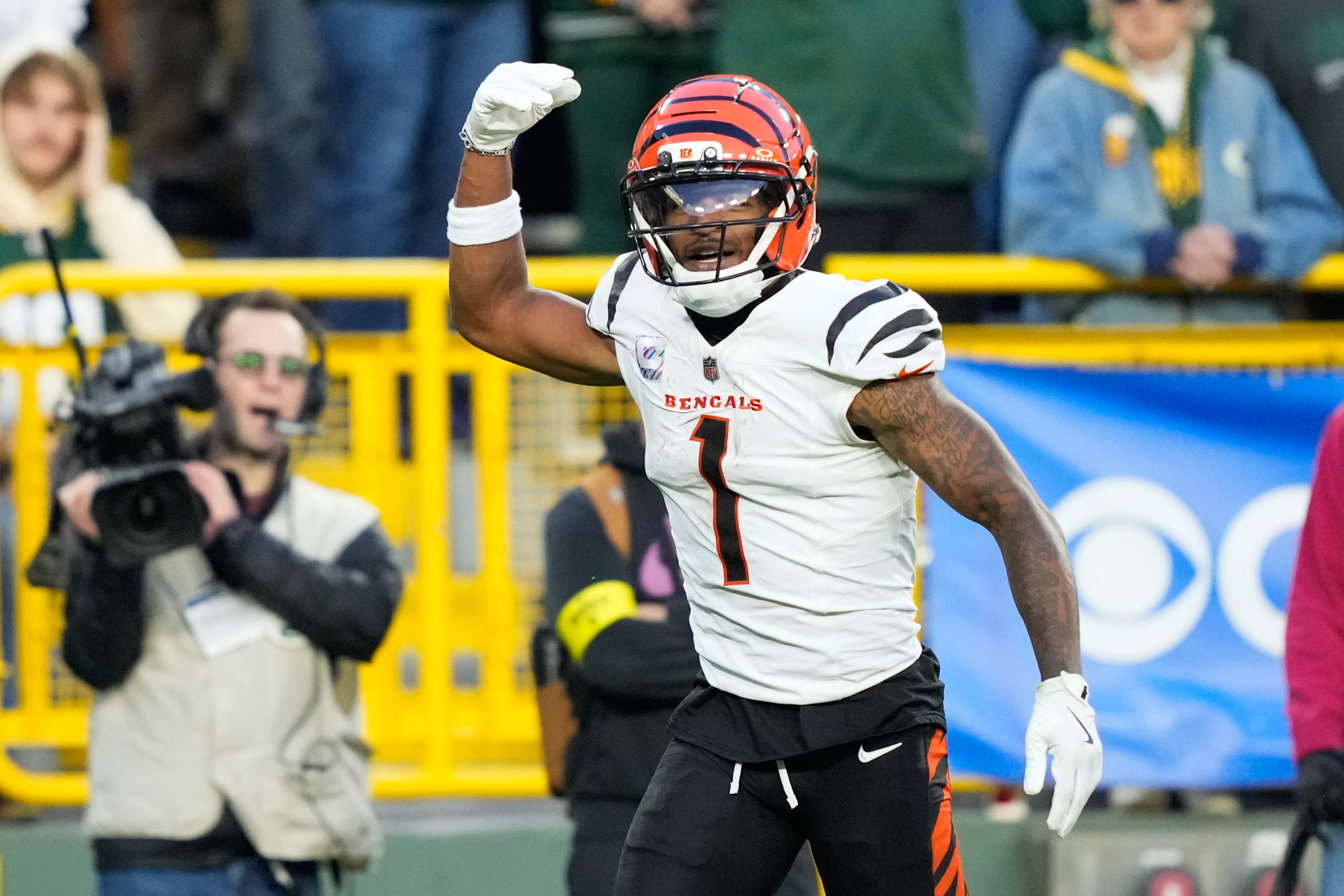 Oct 12, 2025; Green Bay, Wisconsin, USA; Cincinnati Bengals wide receiver Ja'Marr Chase (1) reacts after scoring a touchdown in the fourth quarter against the Green Bay Packers at Lambeau Field.