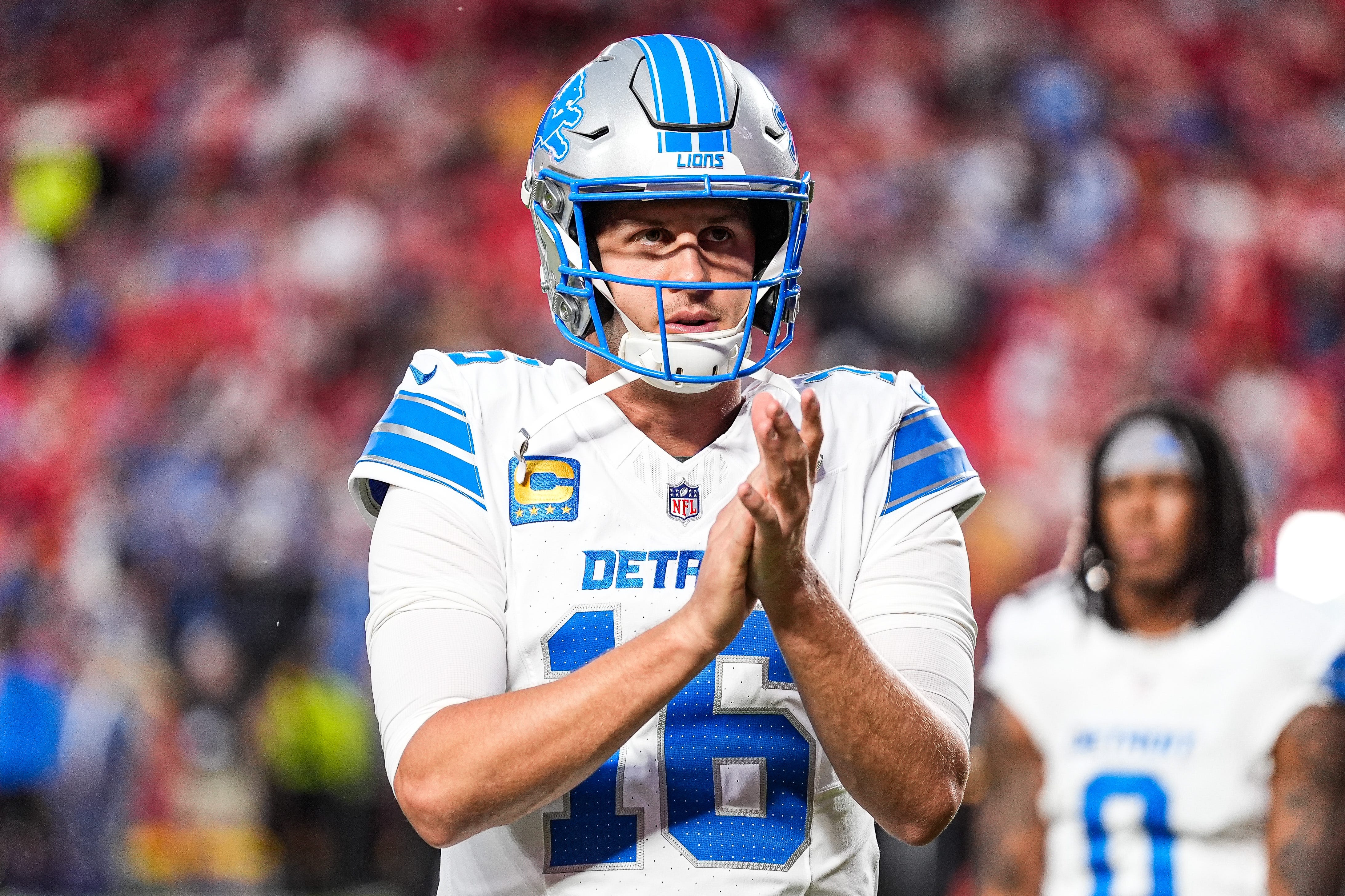 Detroit Lions quarterback Jared Goff (16) cheers for teammates as they get ready to take the field for warm up at Arrowhead Stadium in Kansas City, Missouri on Sunday, Oct. 12, 2025.