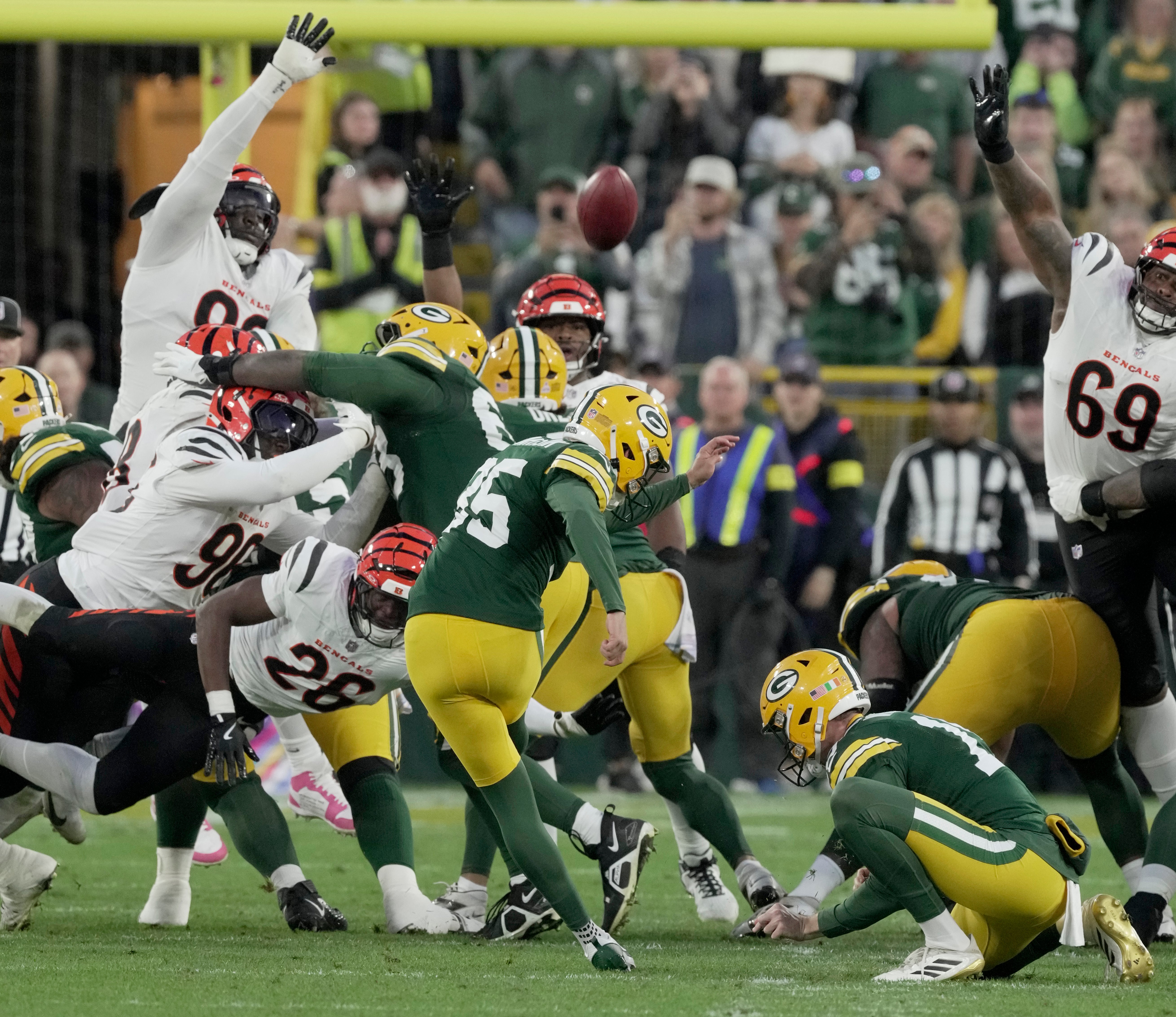 Oct 12, 2025; Green Bay, Wisconsin, USA; Green Bay Packers kicker Lucas Havrisik kicks a field goal against the Cincinnati Bengals during the fourth quarter of their game at Lambeau Field.