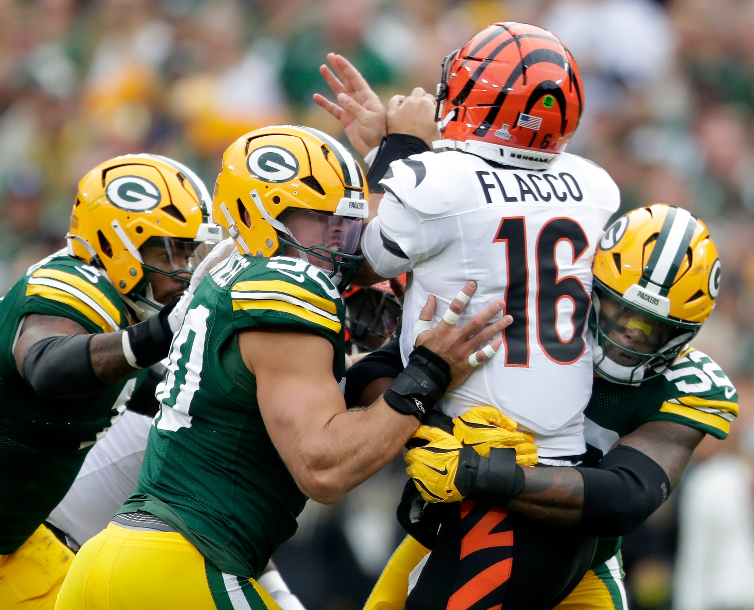 Green Bay Packers defensive end Micah Parsons (1), defensive end Lukas Van Ness (90) and defensive end Rashan Gary (52) pressure Cincinnati Bengals quarterback Joe Flacco (16) on Sunday, October 12, 2025, at Lambeau Field in Green Bay, Wis.Green Bay defeated Cincinnati 27-18.