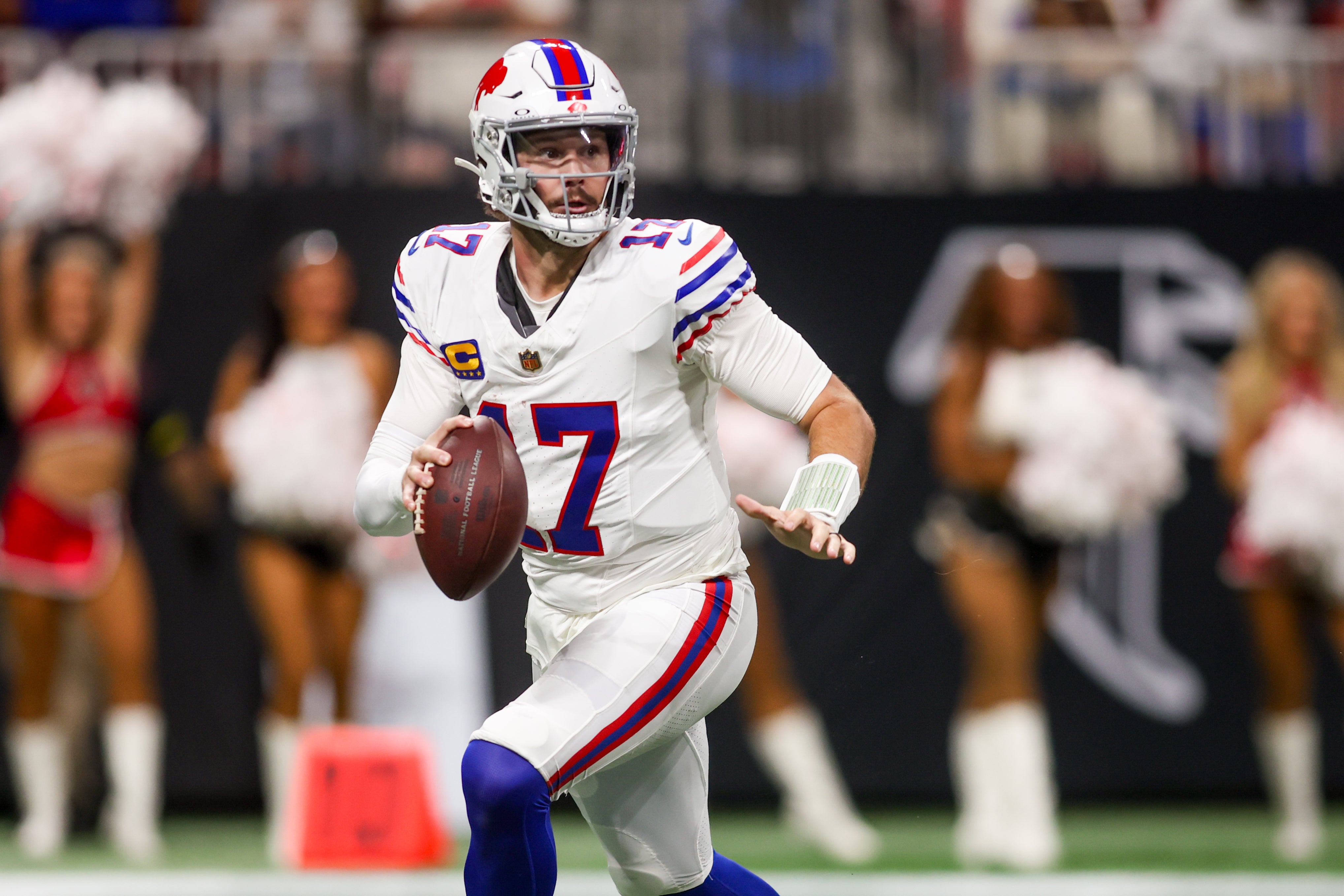 Oct 13, 2025; Atlanta, Georgia, USA; Buffalo Bills quarterback Josh Allen (17) looks downfield against the Atlanta Falcons during the first half of a game at Mercedes-Benz Stadium.