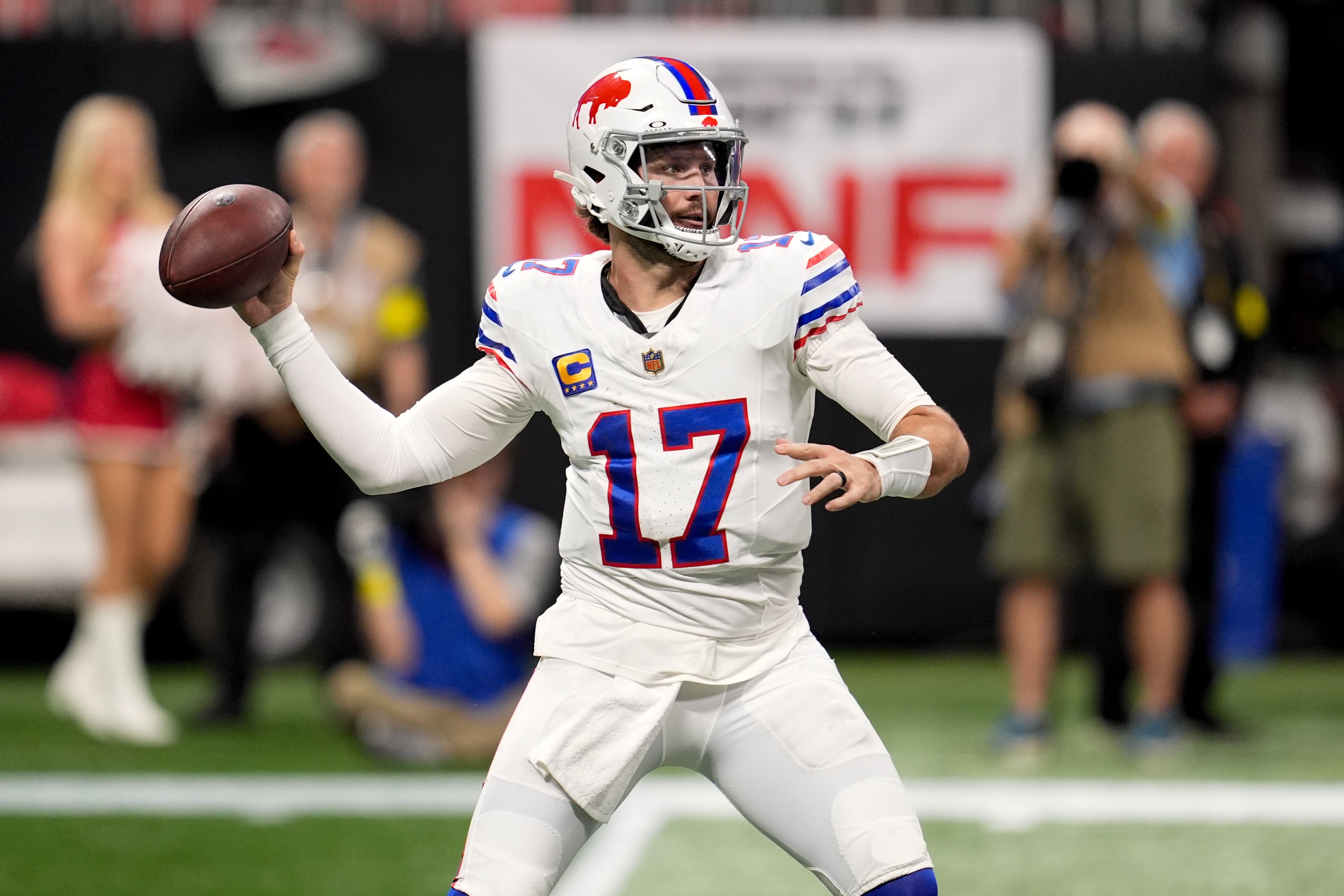 Oct 13, 2025; Atlanta, Georgia, USA;Buffalo Bills quarterback Josh Allen (17) throws downfield against the Atlanta Falcons during the first half of a game at Mercedes-Benz Stadium.