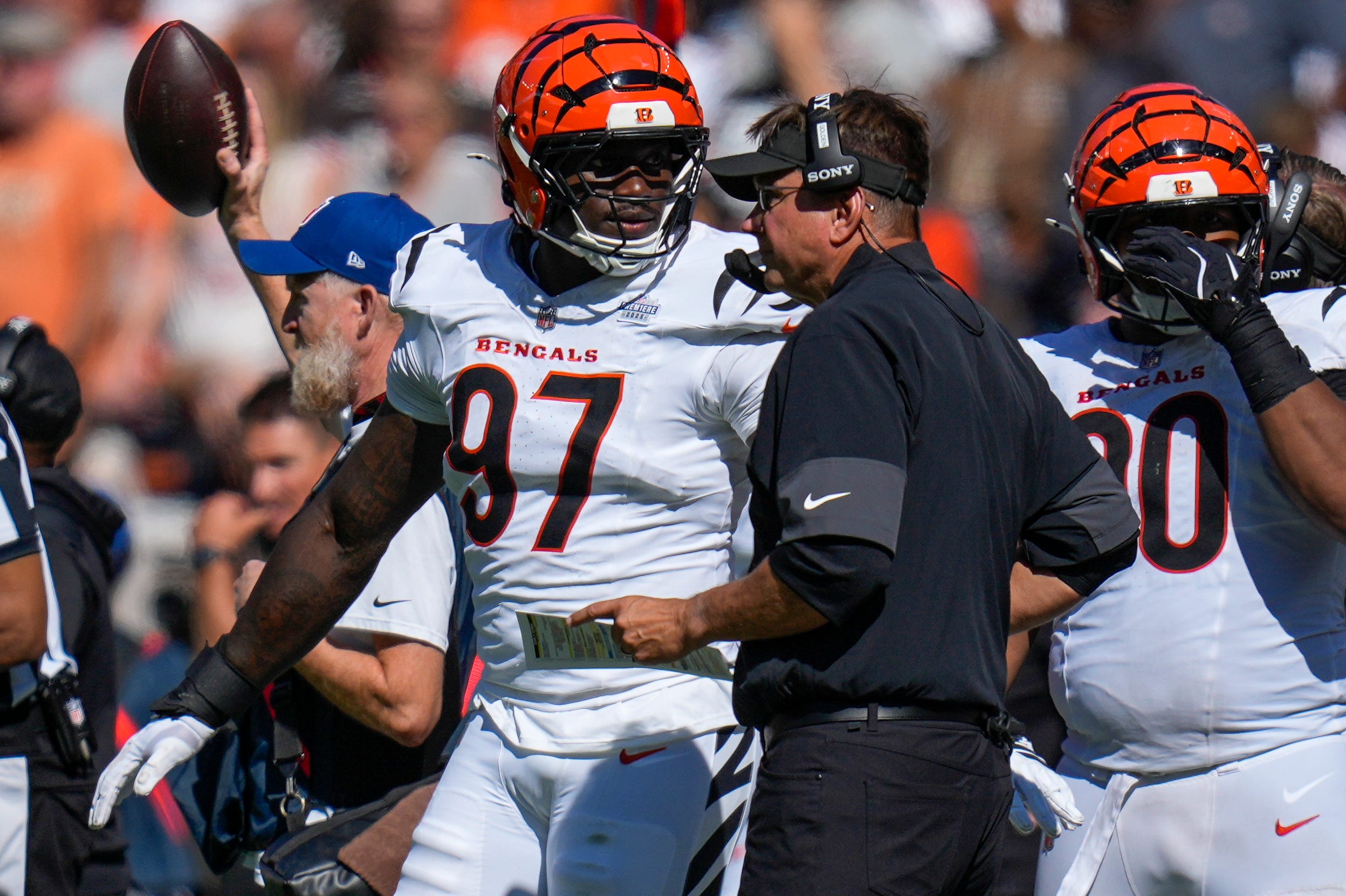 Cincinnati Bengals defensive end Shemar Stewart (97) talks with defensive coordinator Al Golden in the fourth quarter of the NFL Week 1 game between the Cleveland Browns and the Cincinnati Bengals at Huntington Bank Field in Cleveland on Sunday, Sept. 7, 2025. The Bengals begin the season with a 17-16 win over the Browns.