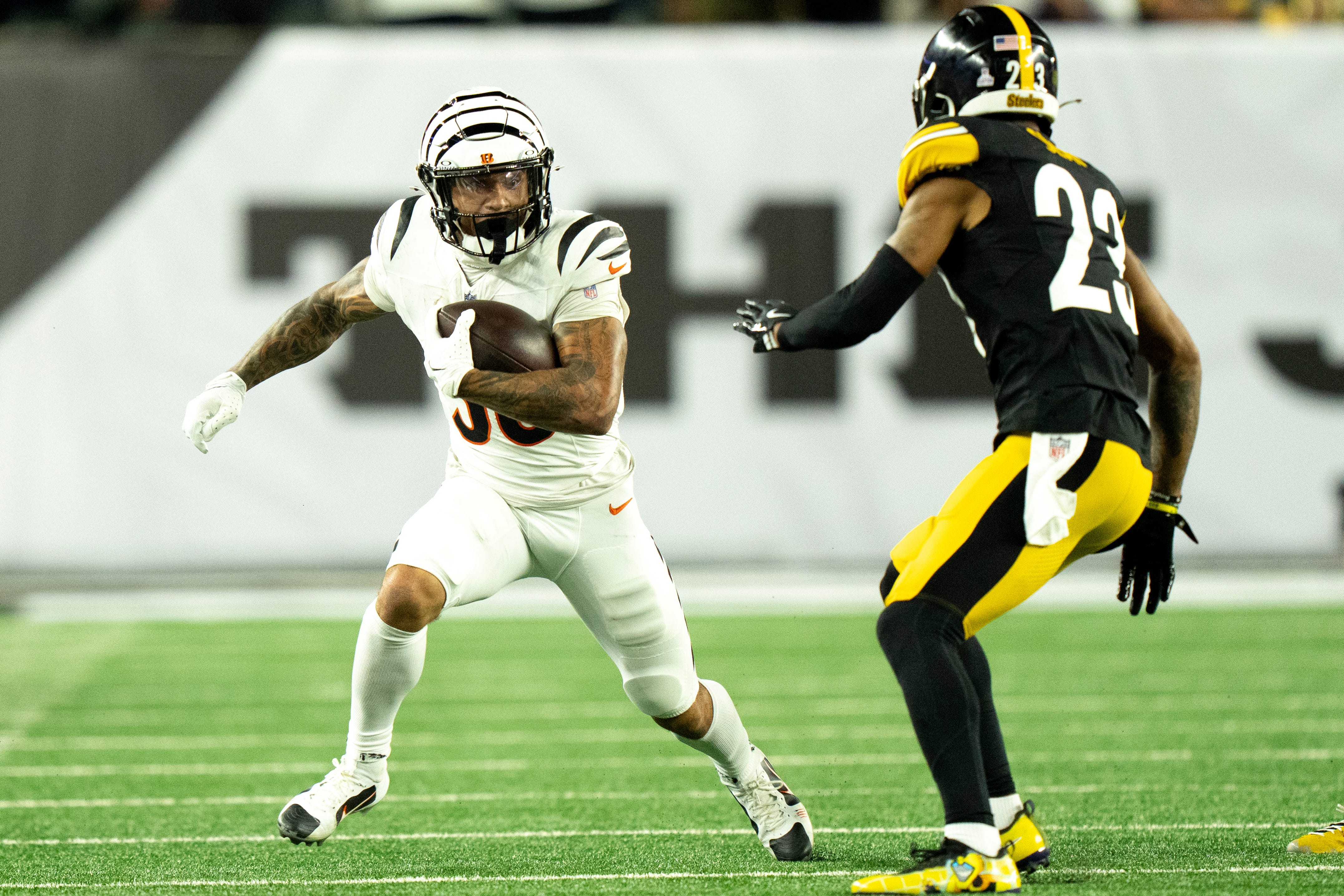 Cincinnati Bengals running back Chase Brown (30) runs downfield in the second quarter of the NFL game between the Cincinnati Bengals and Pittsburgh Steelers at Paycor Stadium in Cincinnati on Oct. 16, 2025.