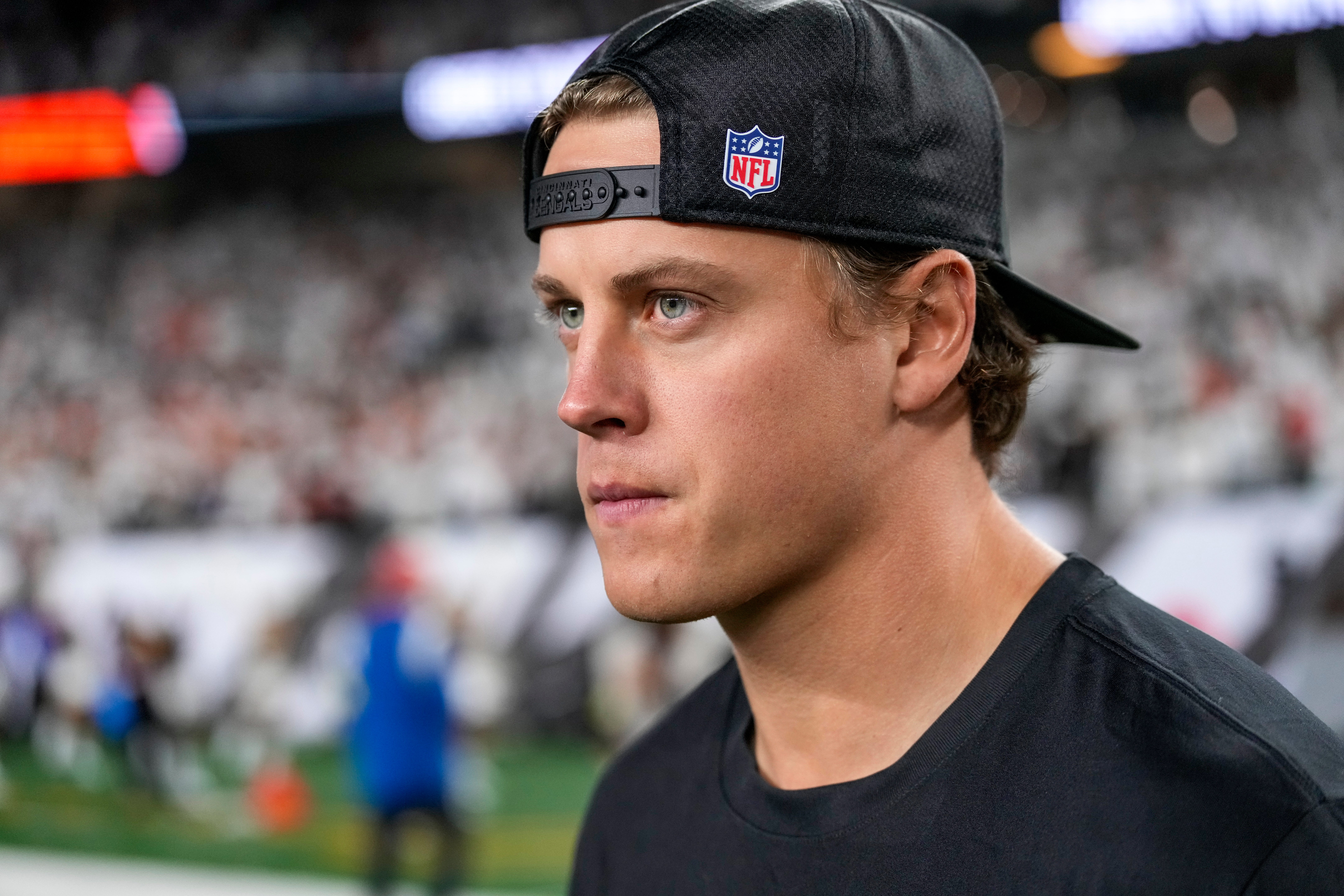 Injured Cincinnati Bengals quarterback Joe Burrow (9) walks on the field after the fourth quarter of the NFL Week 7 game between the Cincinnati Bengals and the Pittsburgh Steelers at Paycor Stadium in downtown Cincinnati on Thursday, Oct. 16, 2025. The Bengals won, 33-31.