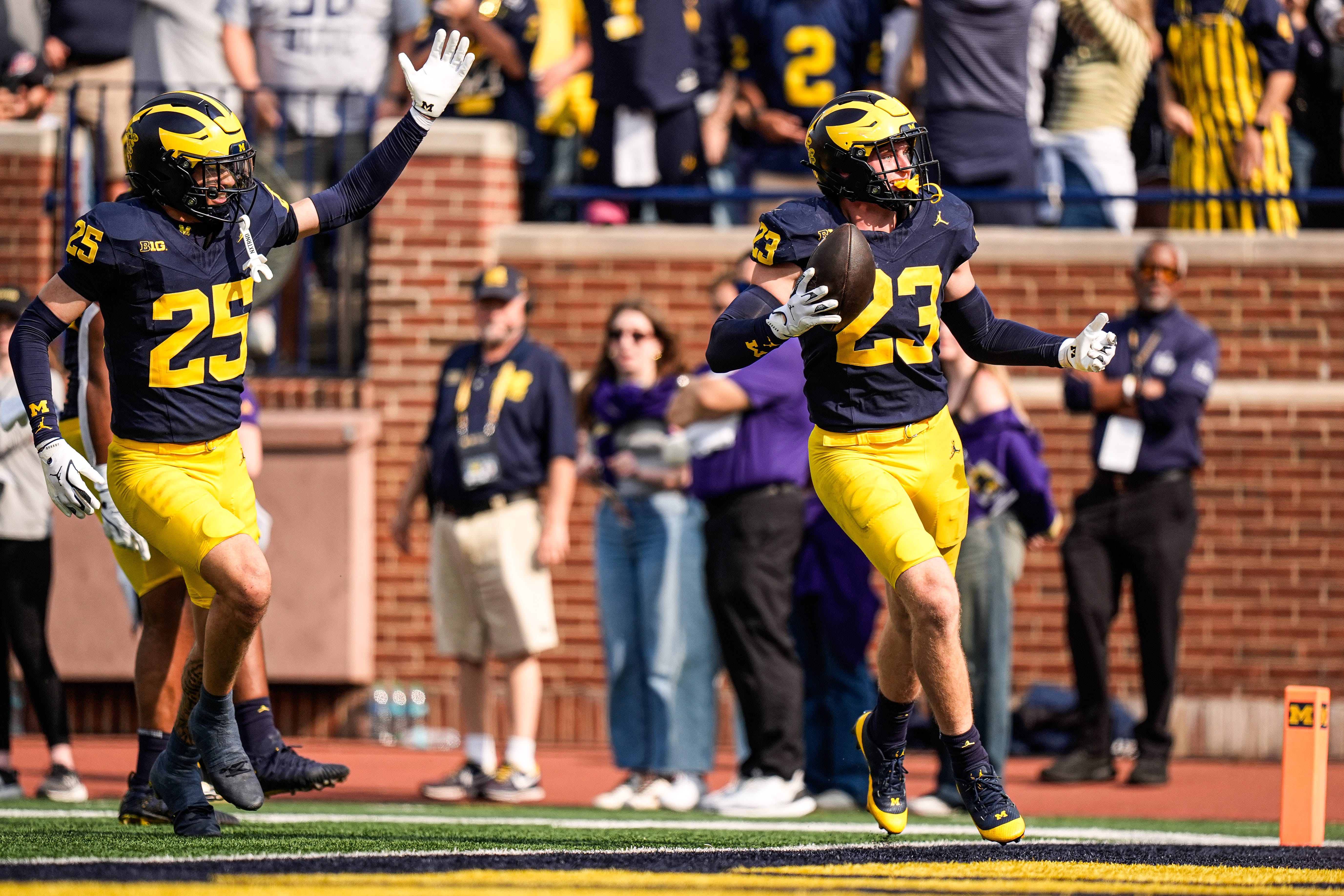 Michigan linebacker Cole Sullivan (23) celebrates an interception against Washington during the second half at Michigan Stadium in Ann Arbor on Saturday, Oct. 18, 2025.