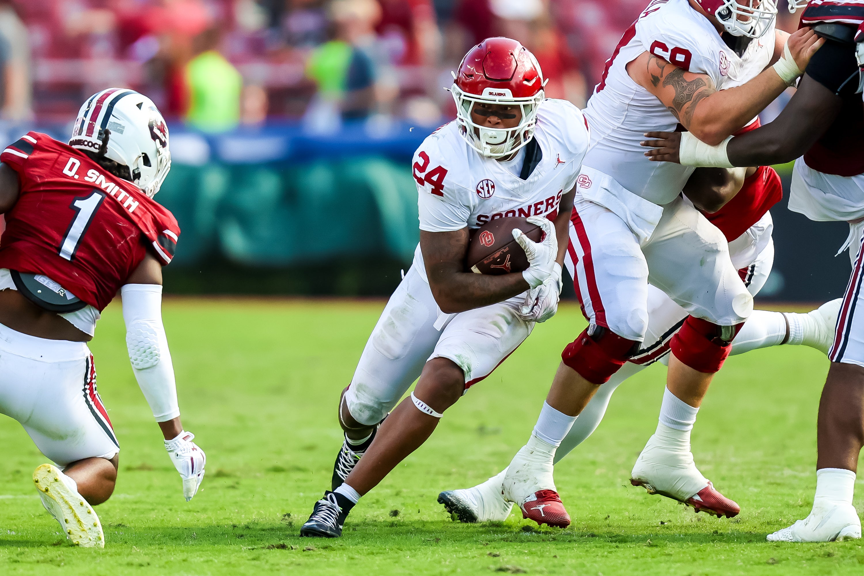 Oct 18, 2025; Columbia, South Carolina, USA; Oklahoma Sooners running back Xavier Robinson (24) rushes against the South Carolina Gamecocks in the second half at Williams-Brice Stadium.