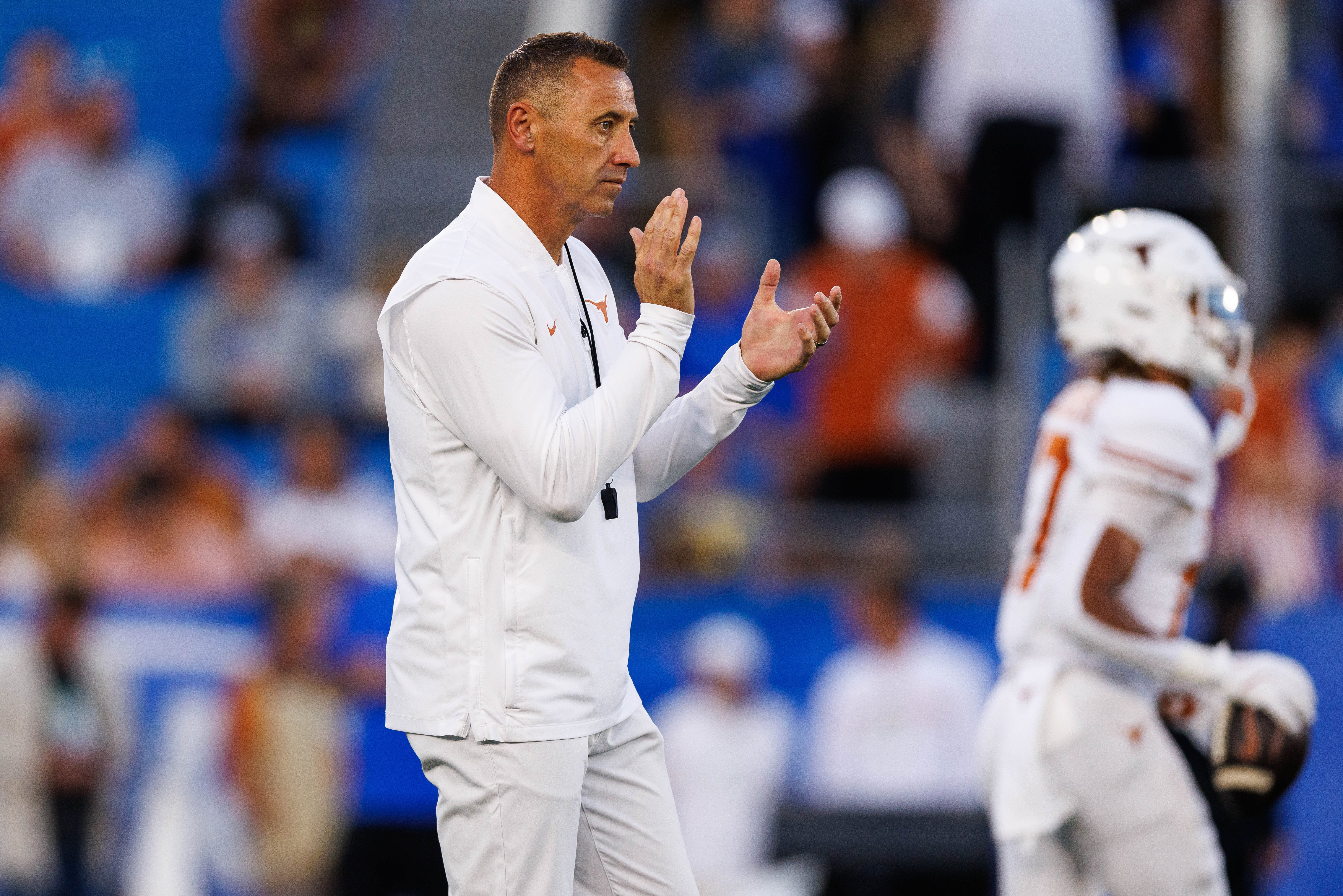 Oct 18, 2025; Lexington, Kentucky, USA; Texas Longhorns head coach Steve Sarkisian claps during warmups before the game against the Kentucky Wildcats at Kroger Field. Mandatory Credit: Jordan Prather-Imagn Images