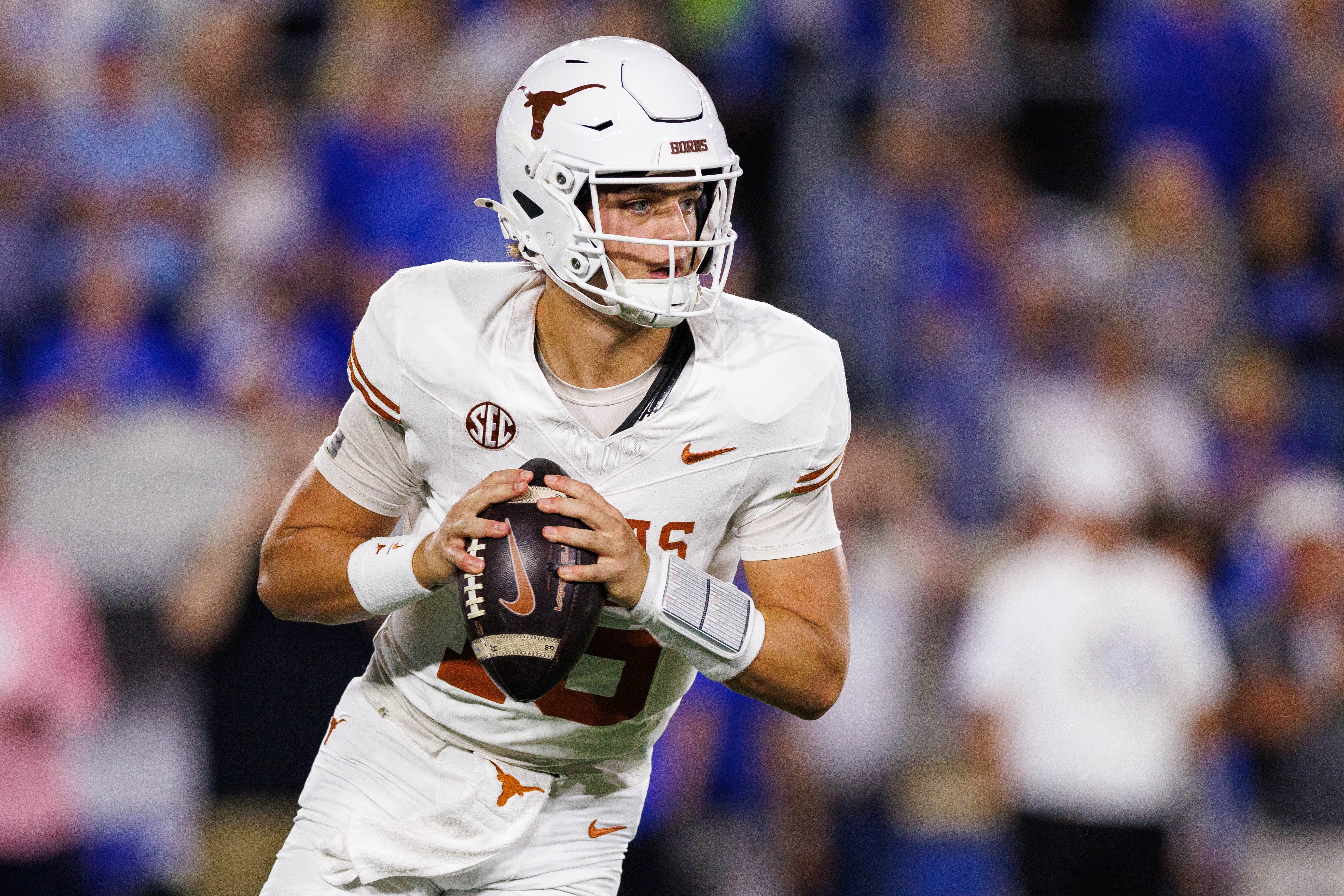 Oct 18, 2025; Lexington, Kentucky, USA; Texas Longhorns quarterback Arch Manning (16) looks for an open receiver during the first quarter against the Kentucky Wildcats at Kroger Field. Mandatory Credit: Jordan Prather-Imagn Images