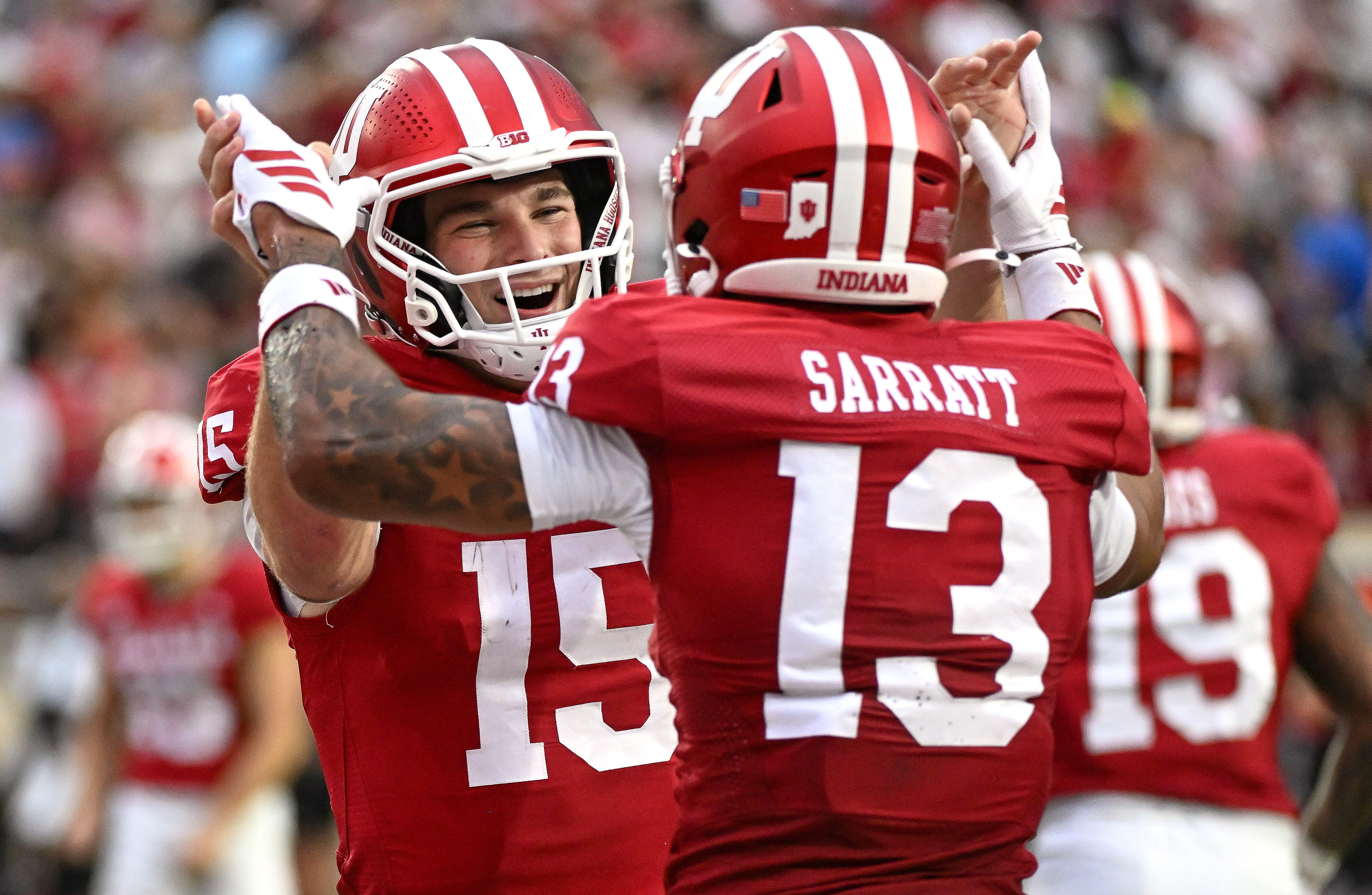 Oct 18, 2025; Bloomington, Indiana, USA; Indiana Hoosiers quarterback Fernando Mendoza (15) and wide receiver Elijah Sarratt (13) celebrate after a touchdown during the second half against the Michigan State Spartans at Memorial Stadium. Mandatory Credit: Robert Goddin-Imagn Images