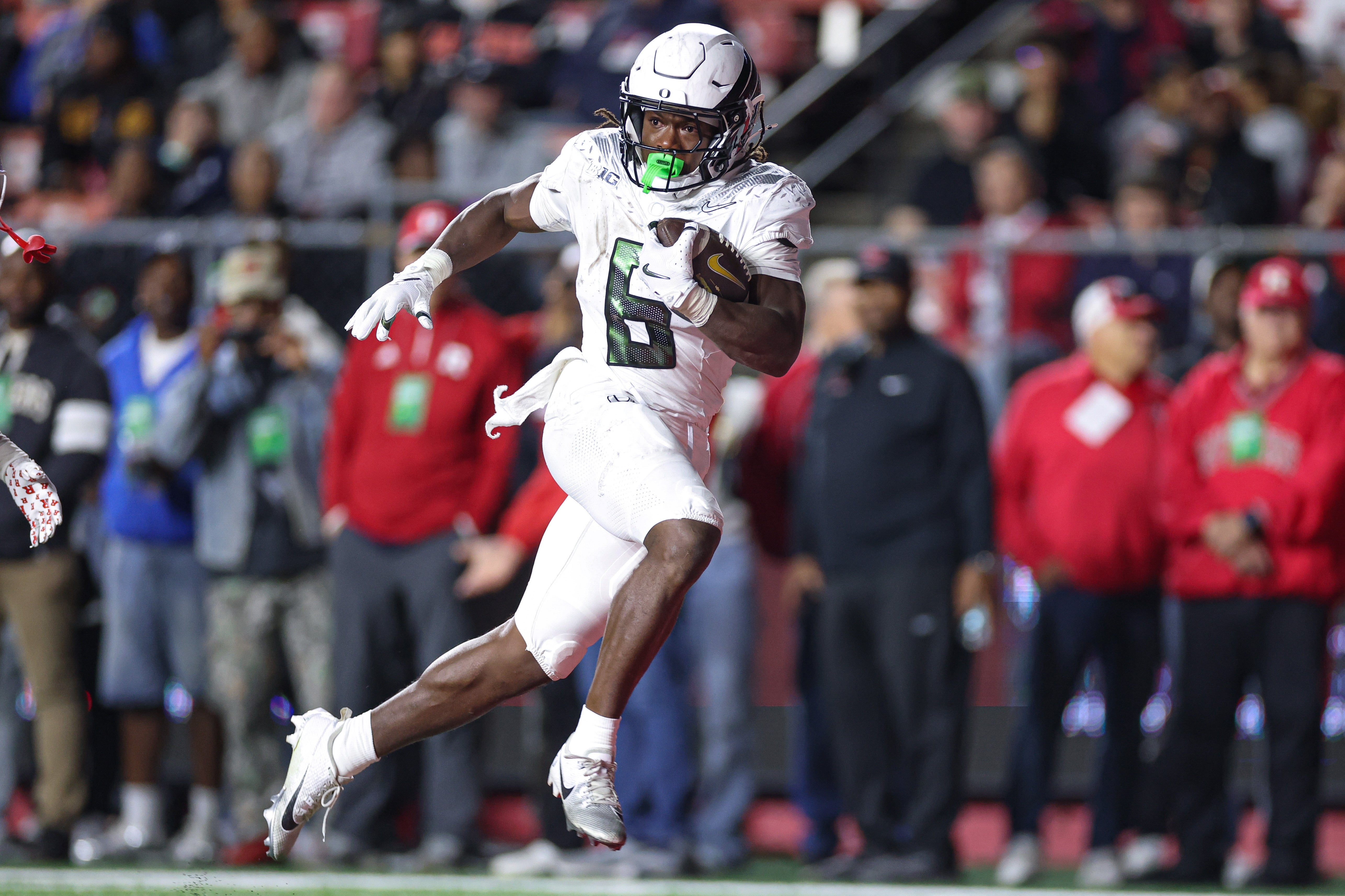 Oct 18, 2025; Piscataway, New Jersey, USA; Oregon Ducks running back Noah Whittington (6) scores a rushing touchdown during the first half against the Rutgers Scarlet Knights at SHI Stadium. Mandatory Credit: Vincent Carchietta-Imagn Images