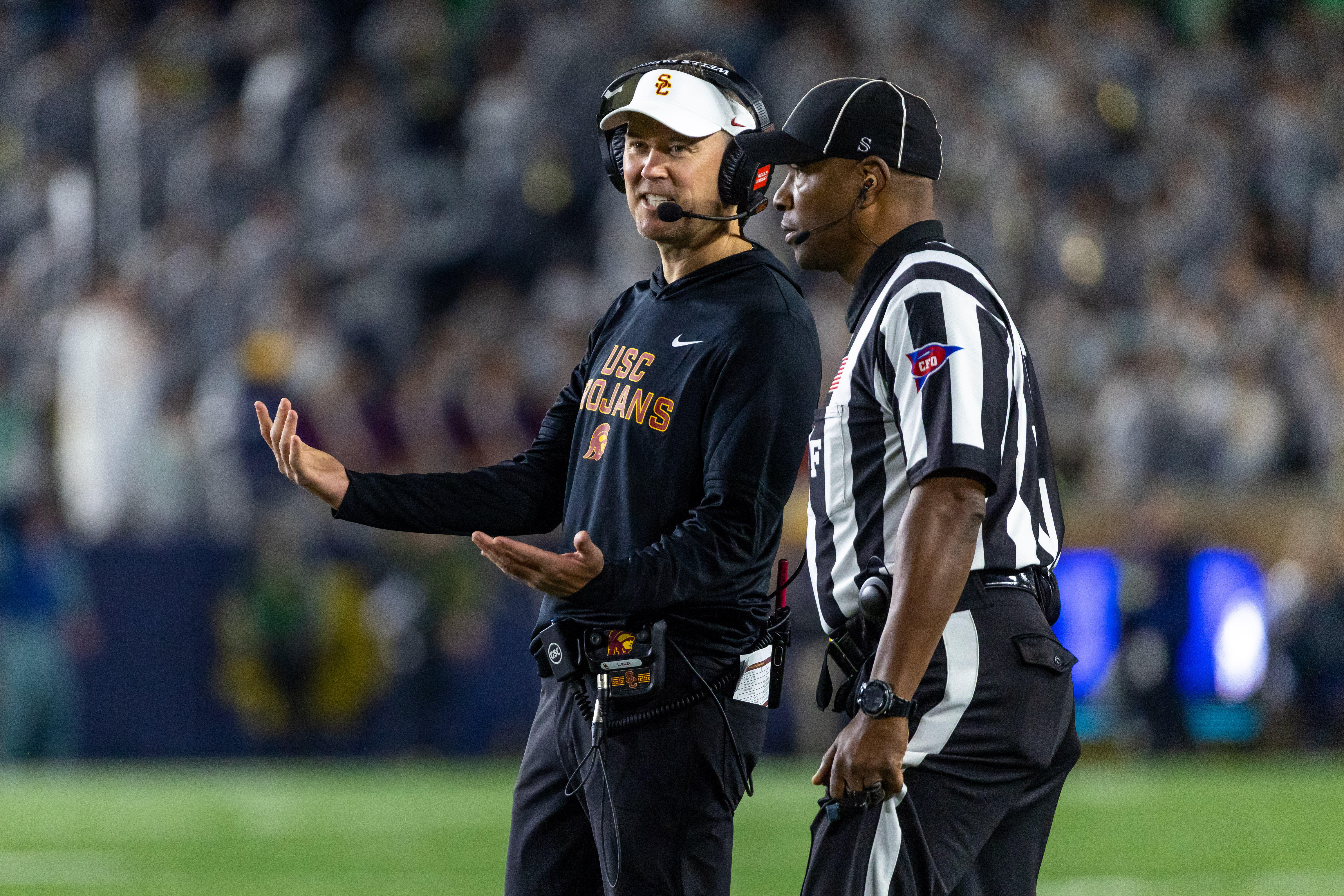 Oct 18, 2025; South Bend, Indiana, USA; Southern California Trojans head coach Lincoln Riley talks to an official during the first half against the Notre Dame Fighting Irish at Notre Dame Stadium. Mandatory Credit: Michael Caterina-Imagn Images
