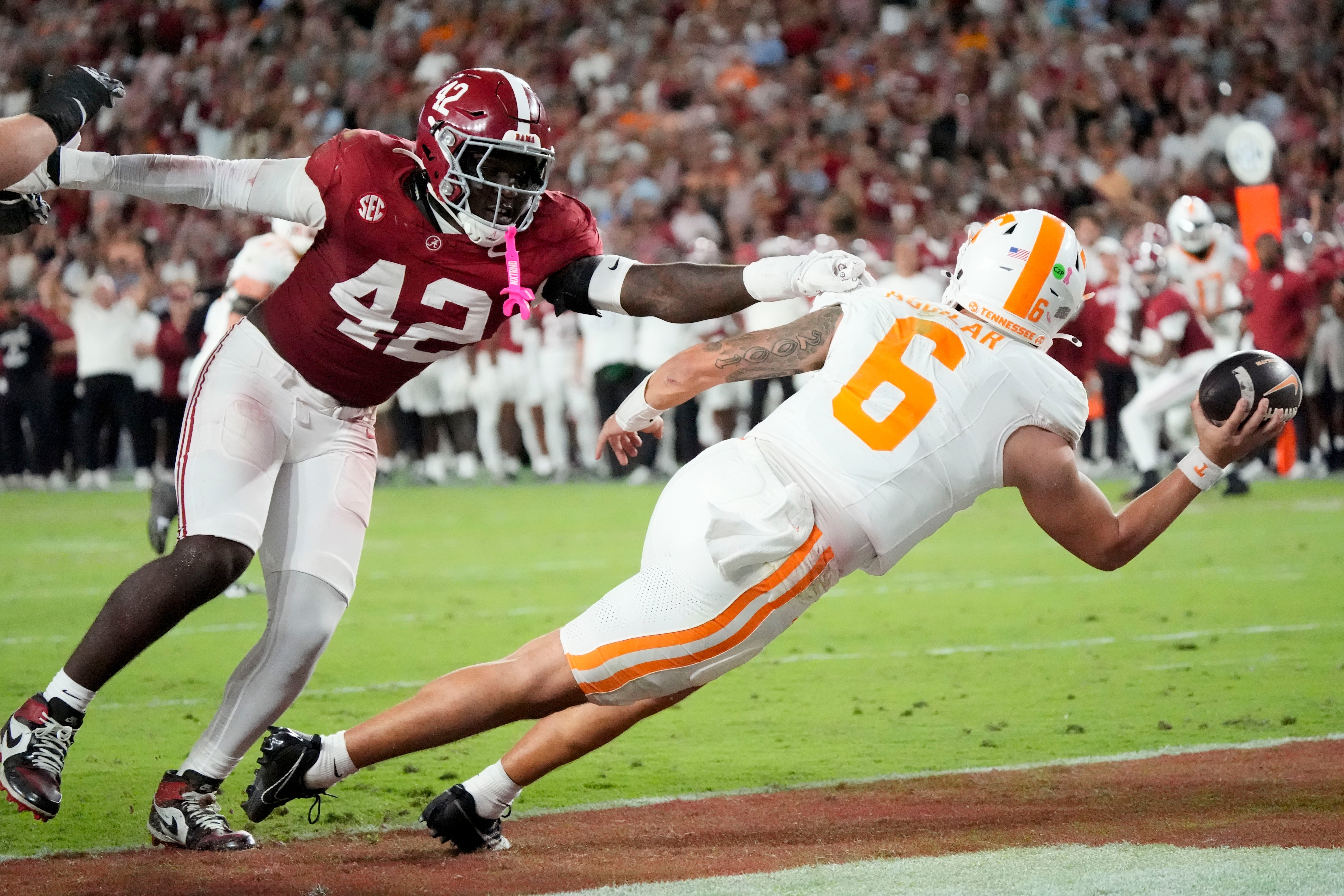 Oct 18, 2025; Tuscaloosa, Alabama, USA; Alabama linebacker Yhonzae Pierre (42) pressures Tennessee quarterback Joey Aguilar (6) into throwing the ball away in the end zone, resulting in a safety in the second quarter at Saban Field at Bryant-Denny Stadium.