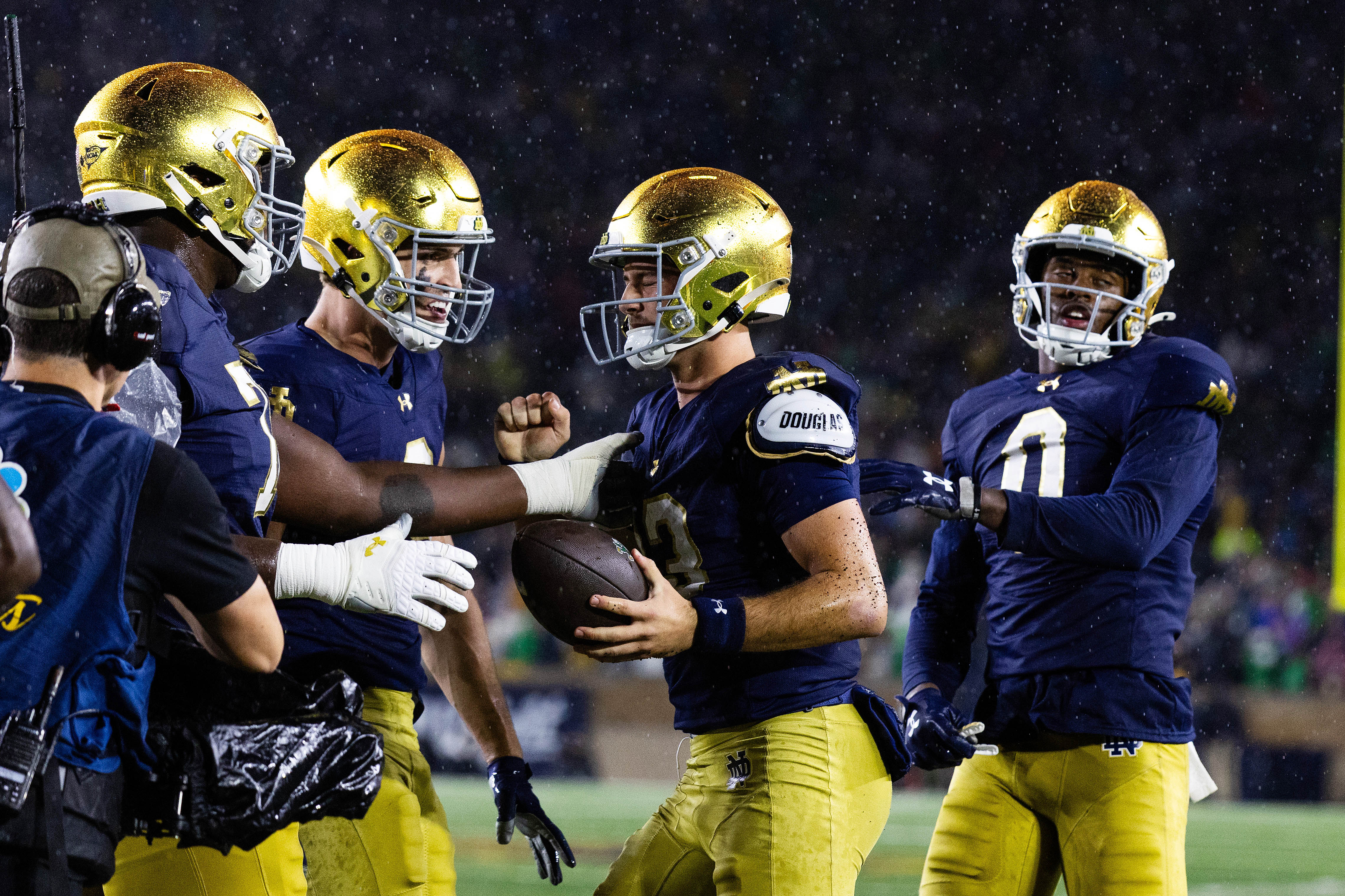 Oct 18, 2025; South Bend, Indiana, USA; Notre Dame Fighting Irish quarterback CJ Carr (13) celebrates his touchdown with teammates in the second half at Notre Dame Stadium. Mandatory Credit: Trevor Ruszkowski-Imagn Images