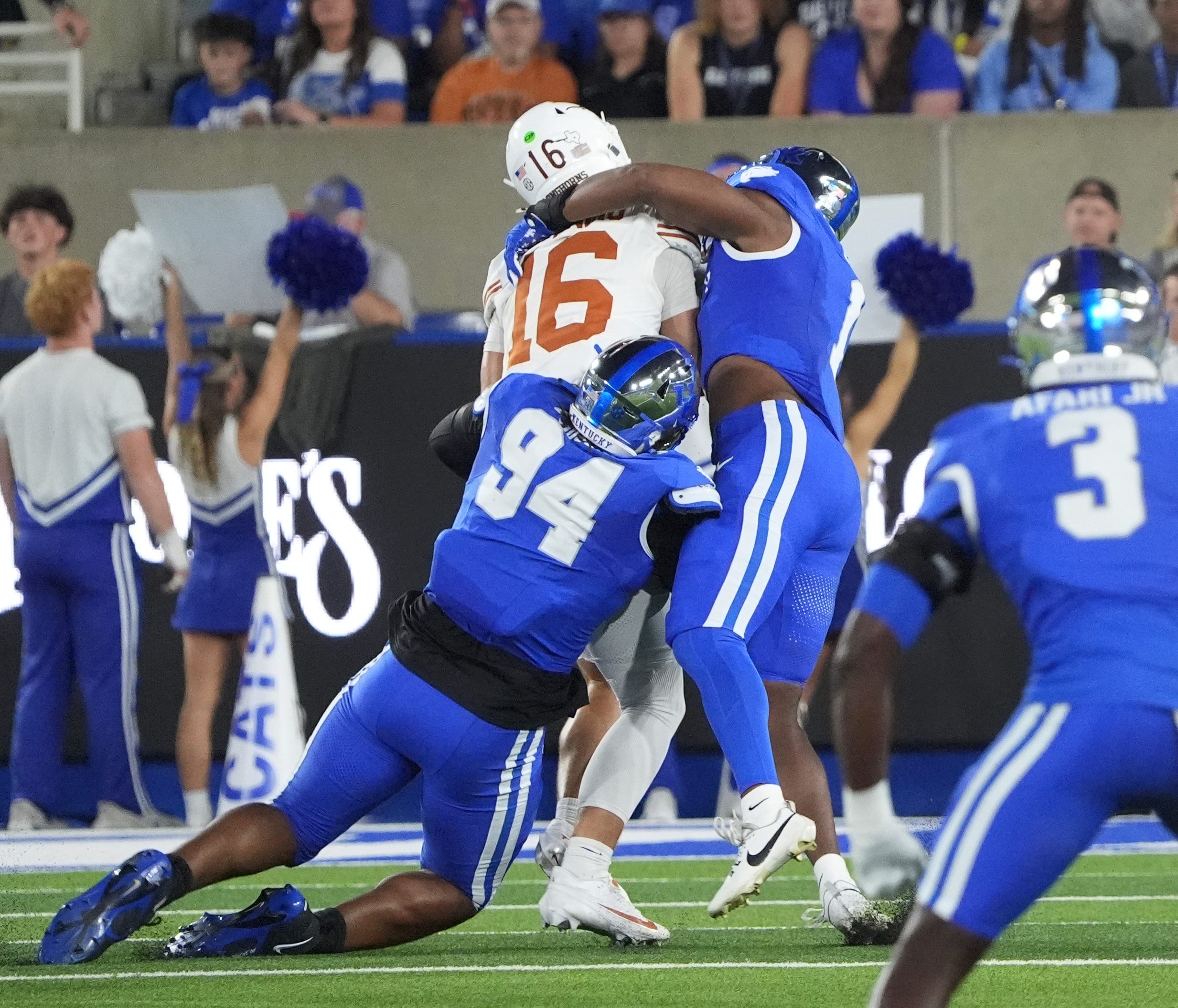 Kentucky’s Kam Olds and Tavion Gadson (94) sacks Texas’ Arch Manning Saturday night at Kroger Field. Oct. 18, 2025